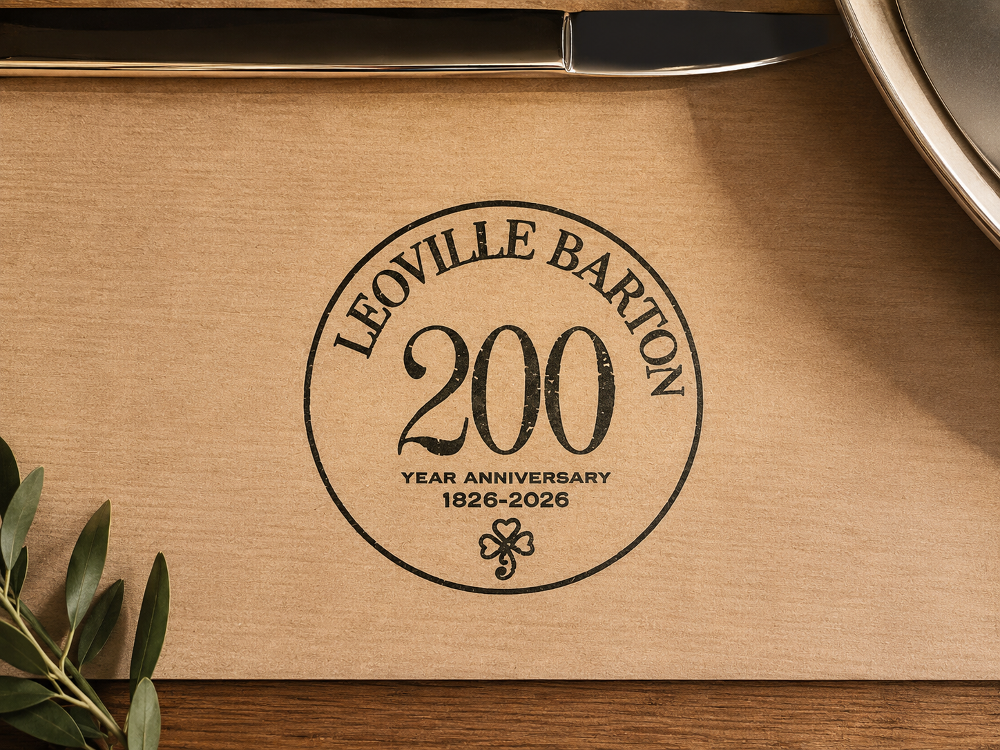 A cardboard box with a Leoville Barton 200 Year Anniversary logo printed on it, celebrating 1826-2026.