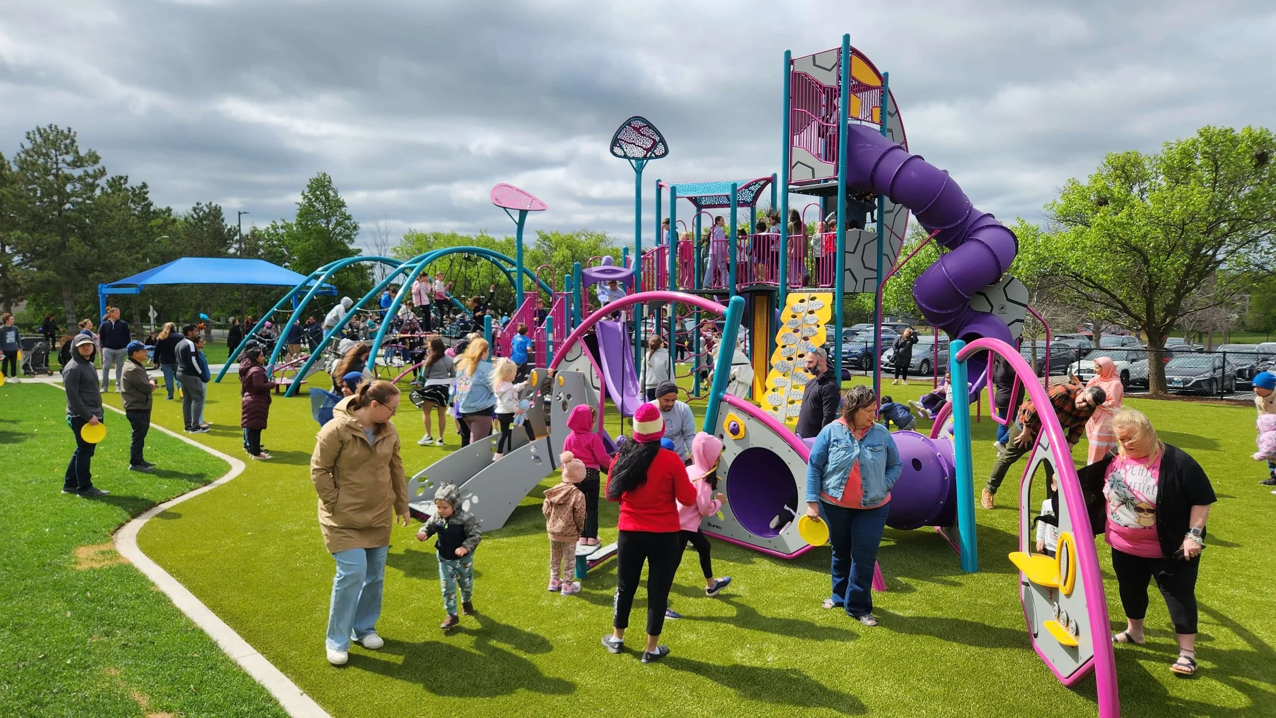 New Moon Lake Park Playground Filled with Children and Families