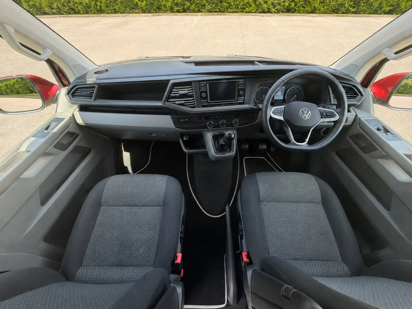 ront driver and passenger cabin of the 2022 VW Transporter Highline campervan for hire in Glasgow.