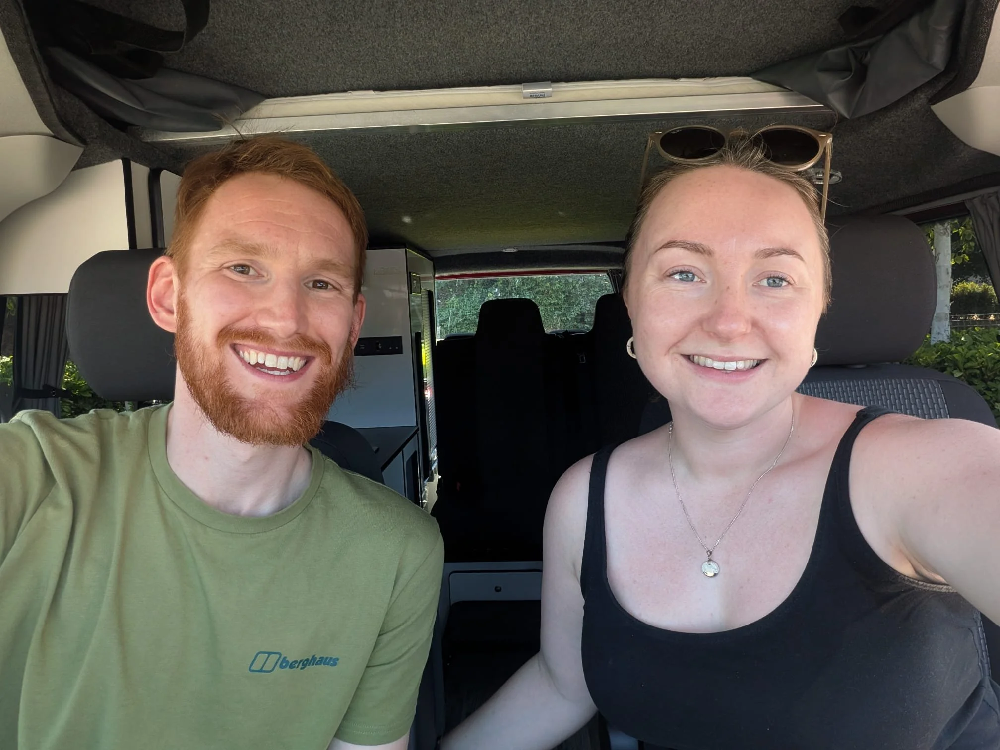 Duncan and Sarah the proud owners of Coorie Campers, Glasgow sitting in their VW campervan.