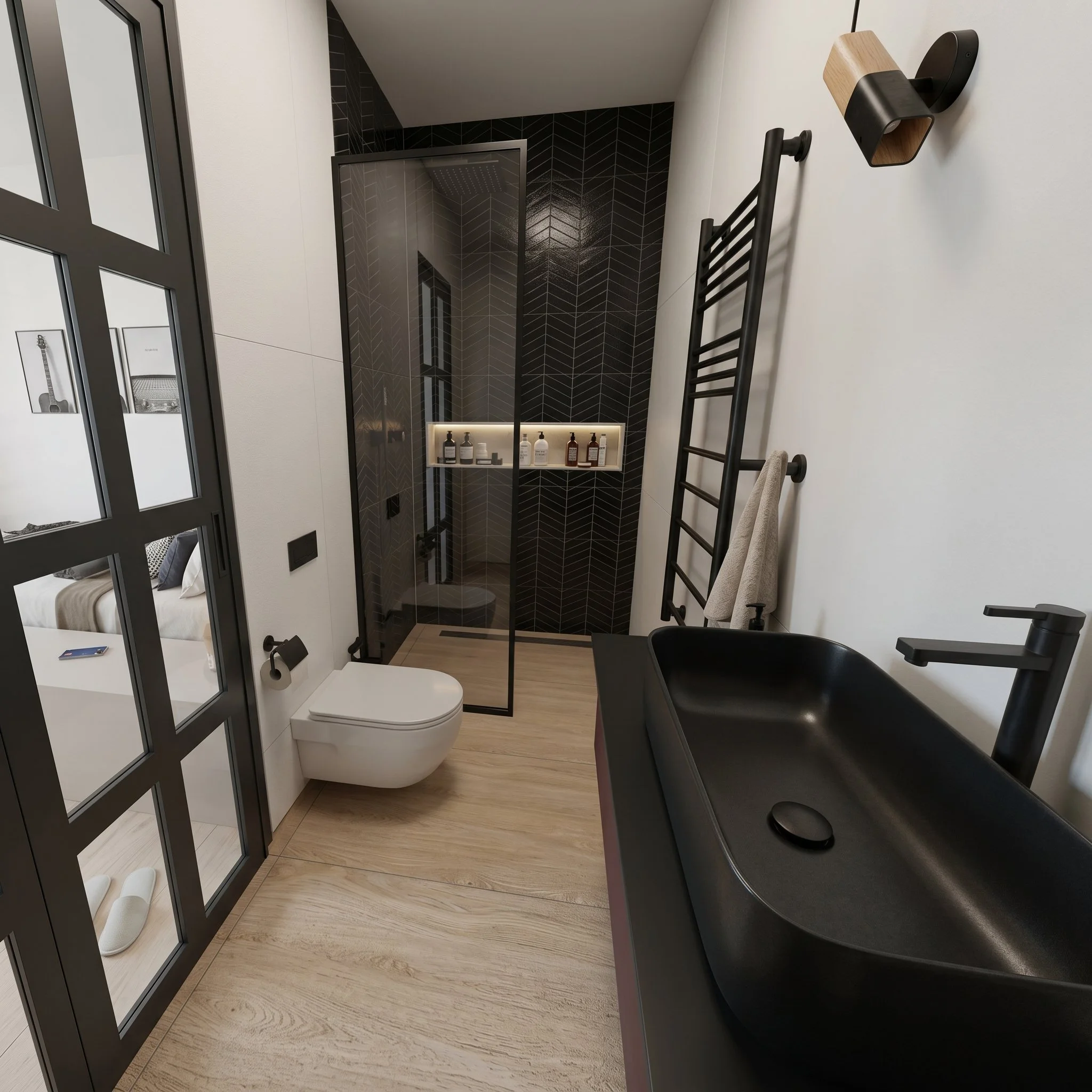 Modern compact bathroom in Mini Loft with black matte rectangular sink, black faucet, walk-in glass shower with herringbone black tiles, wall-mounted toilet and minimalist dark accents creating a sleek, functional space
