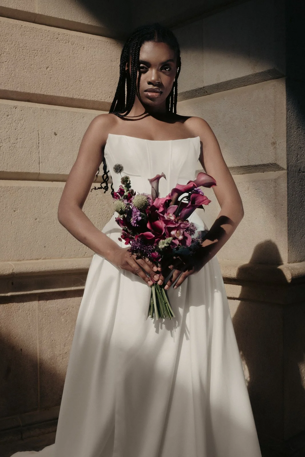Editorial bridal fashion portrait featuring luxury floral styling