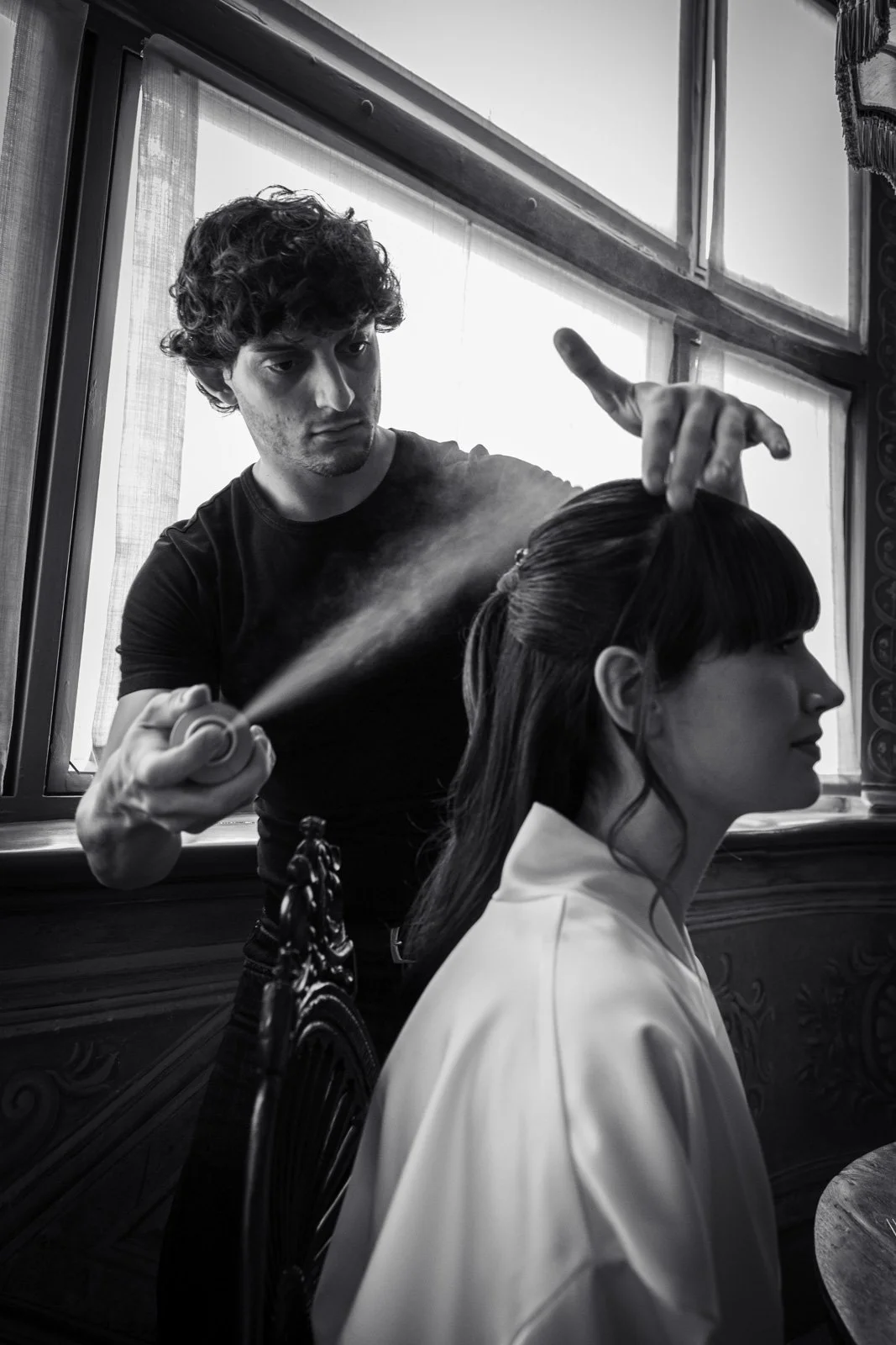 Luxury wedding hairstylist preparing bride during bridal editorial workshop