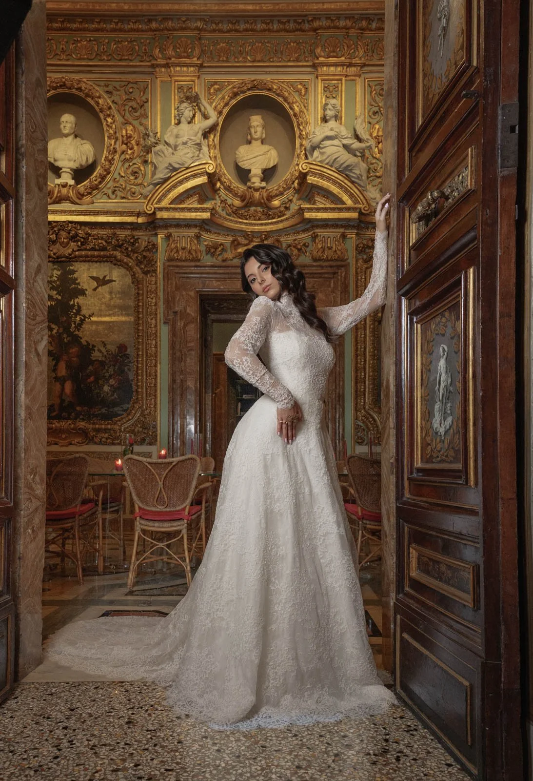 Bride posing inside ornate palace during luxury wedding editorial in Rome