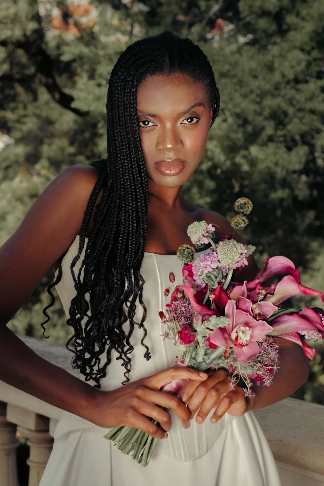 Romantic bridal portrait featuring floral bouquet and editorial wedding styling