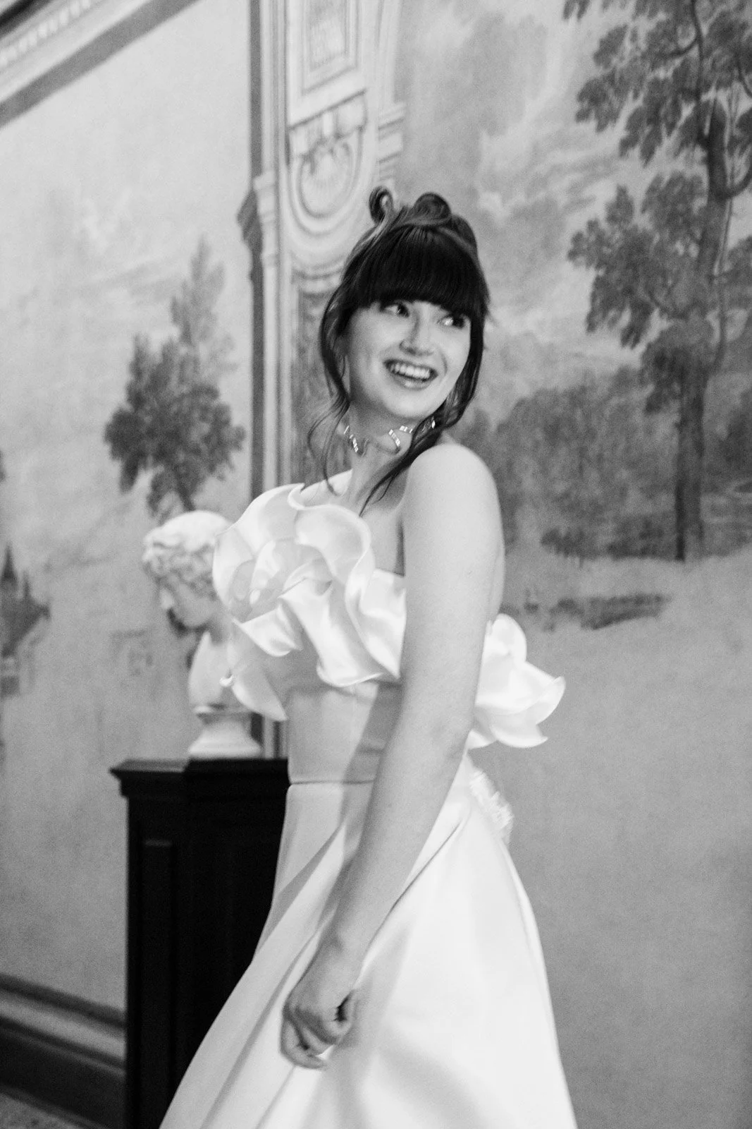 Black and white bridal portrait holding bouquet during editorial wedding shoot