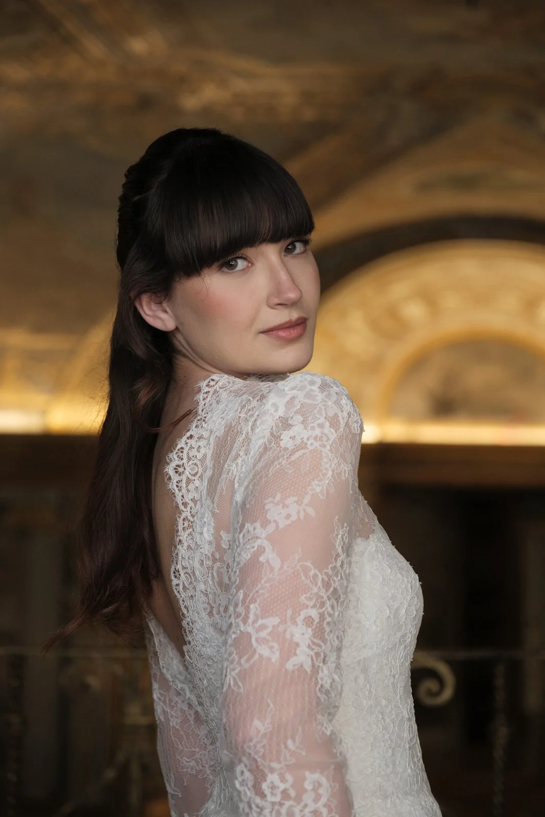 Bride wearing dramatic veil during fine art bridal editorial