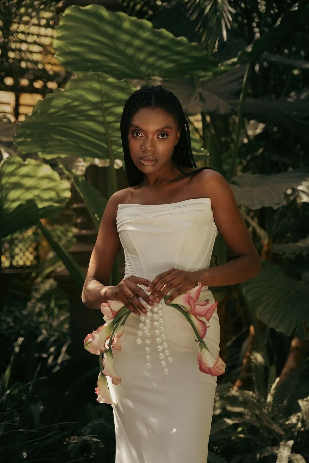 Bride in elegant couture dress photographed in tropical garden for Daybory Garden editorial