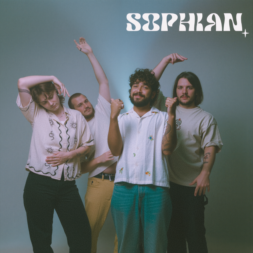 Group of four people posing against a plain background with 'SOPHIA' written upside down at the top.
