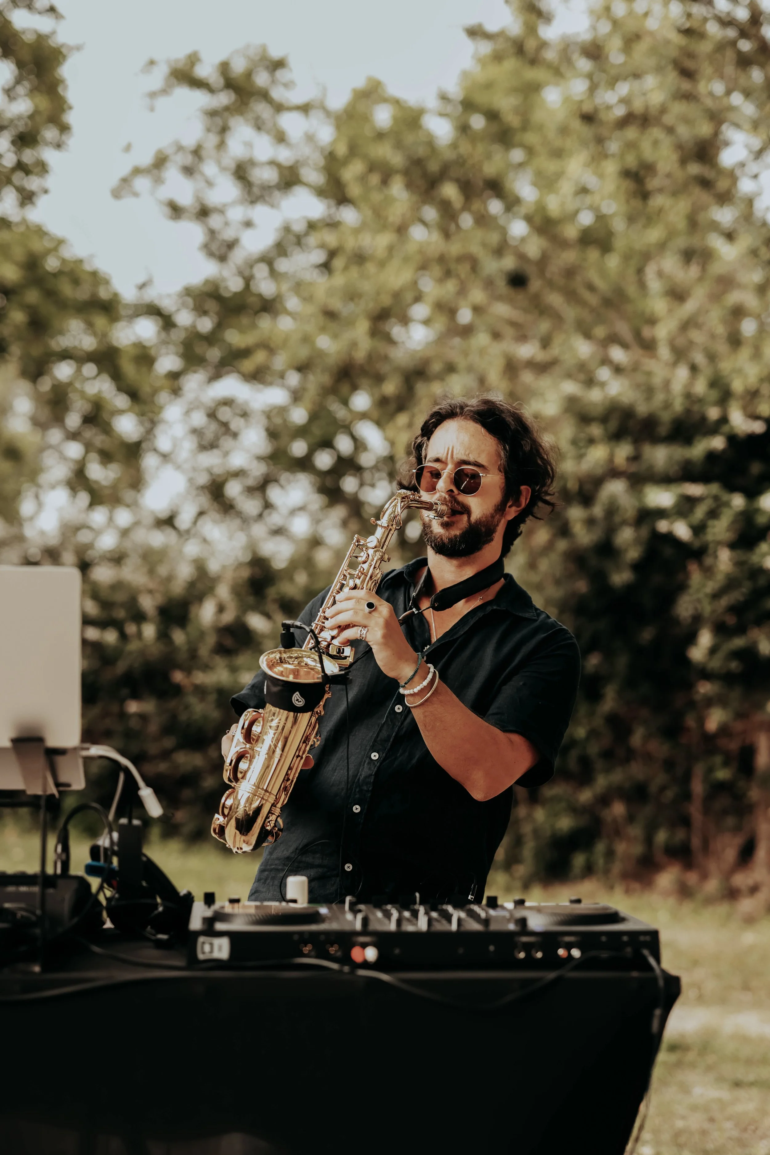 Rafa Digraz performing live saxophone and dj on stage luxury event