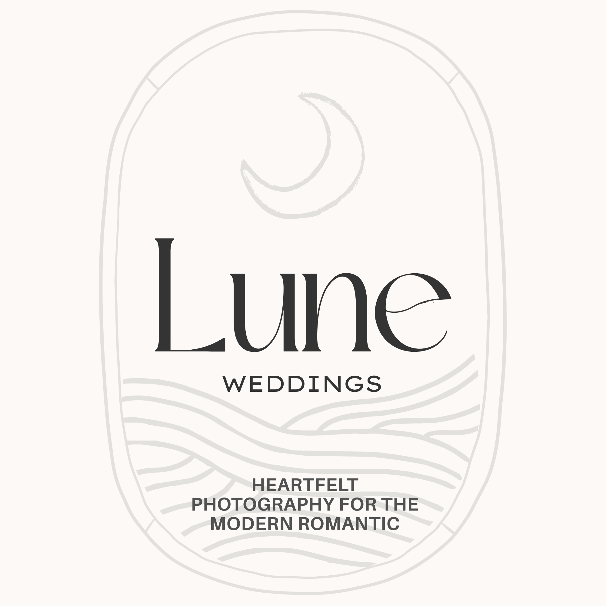 Close-up of a white sign with black text that reads 'Love Weddings Heartfelt Photography for the Modern Romantic'.