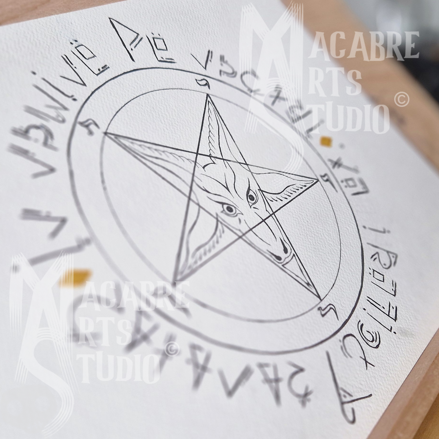 A drawing of the sigil of Baphomet with custom designed runes around the edges. Overlaid with copyright watermark.