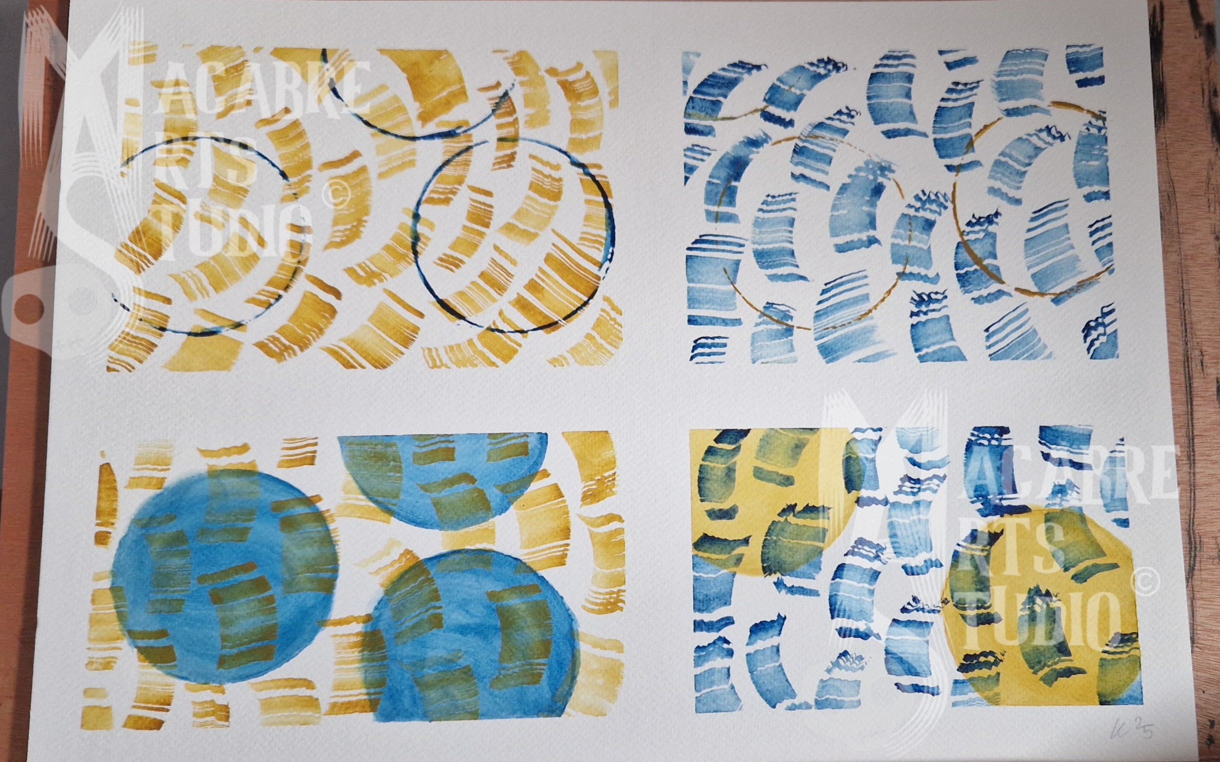 Artistic prints featuring blue and yellow abstract designs, arranged in a grid pattern. Overlaid with MAS copyright logo.