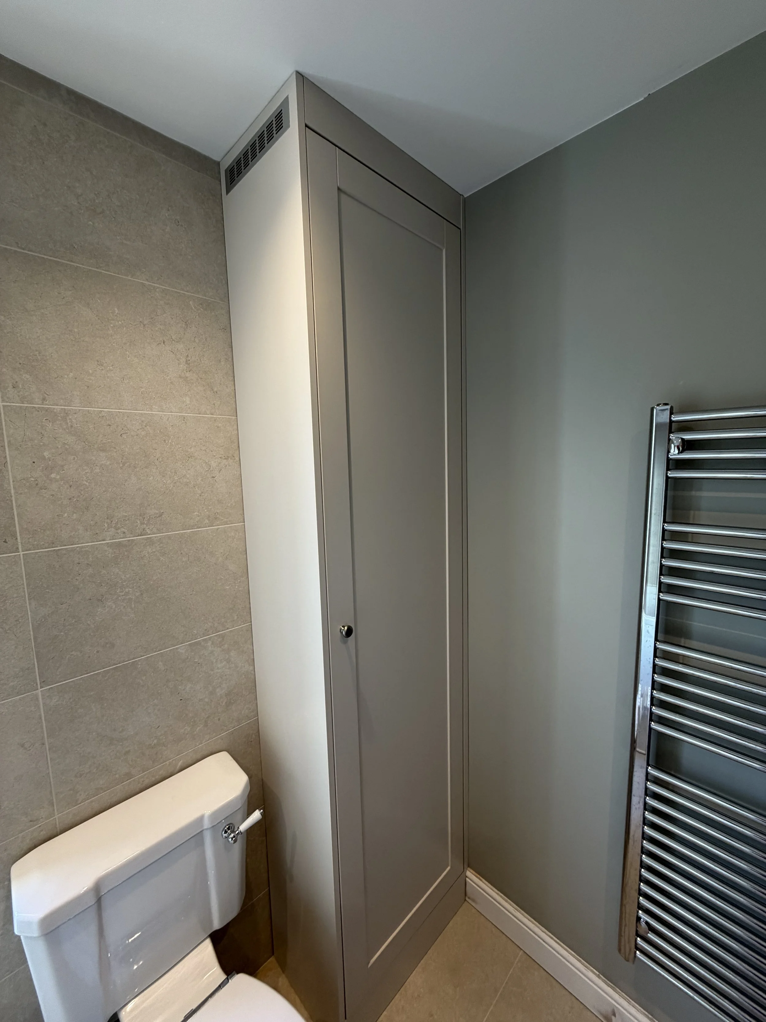 Bespoke Wooden Bathroom Boiler Cupboard, Hand Paint Spray Finishing in 'Farrow & Ball Skimming Stone' by Broadstone Interiors. 

Partnership project with  S3 Carpentry.