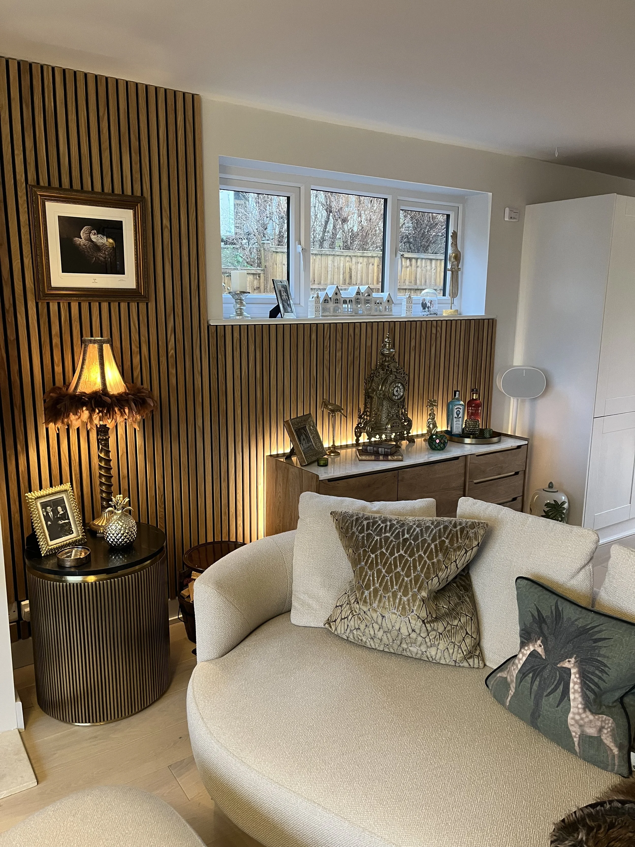 After - Acoustic Wood Lounge Panelling & Interior Design by Broadstone Interiors with lighting to add an elegant look.