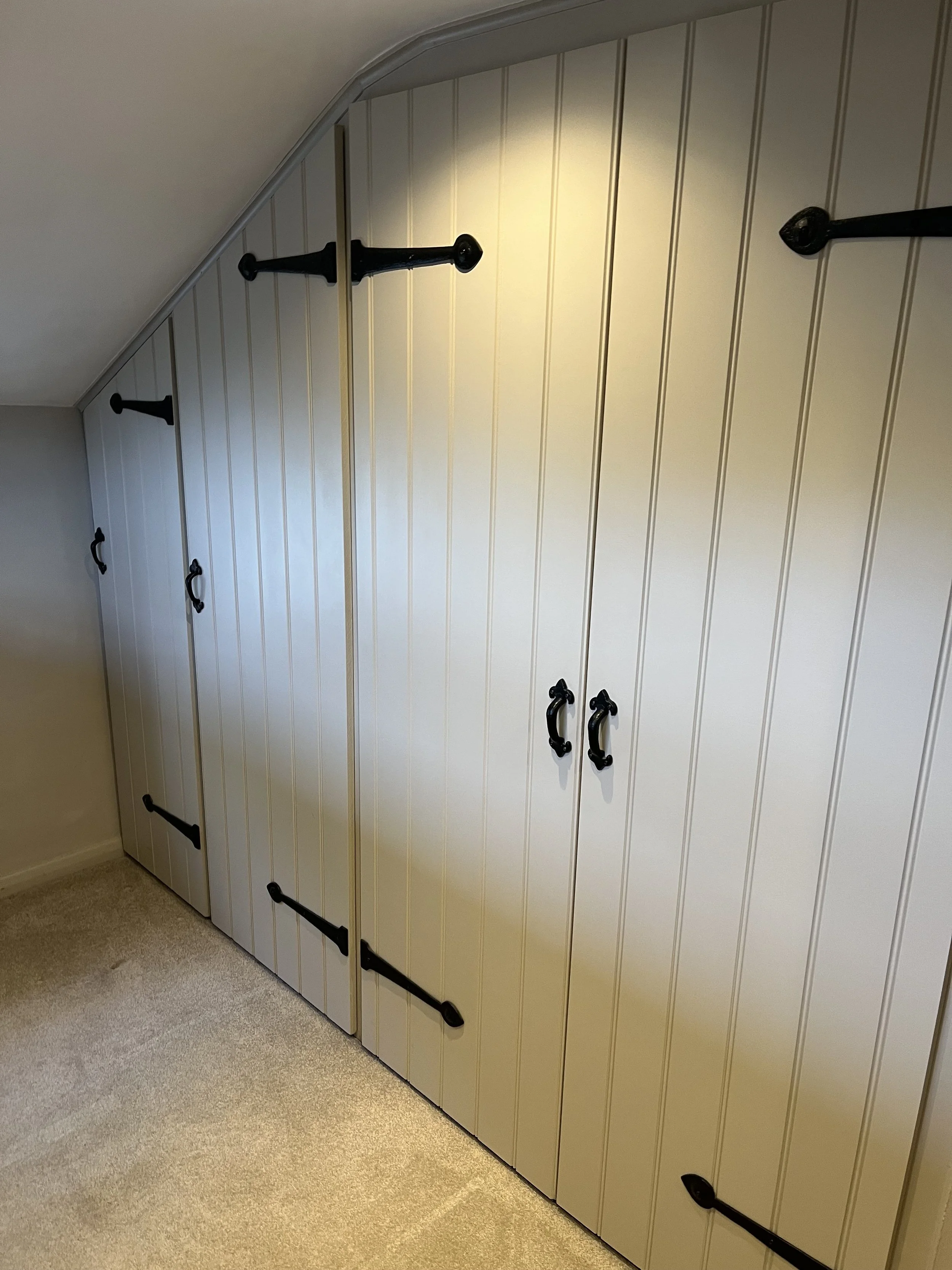 Bespoke Handcrafted and Painted, Scribed Wooden Fitted Wardrobes.