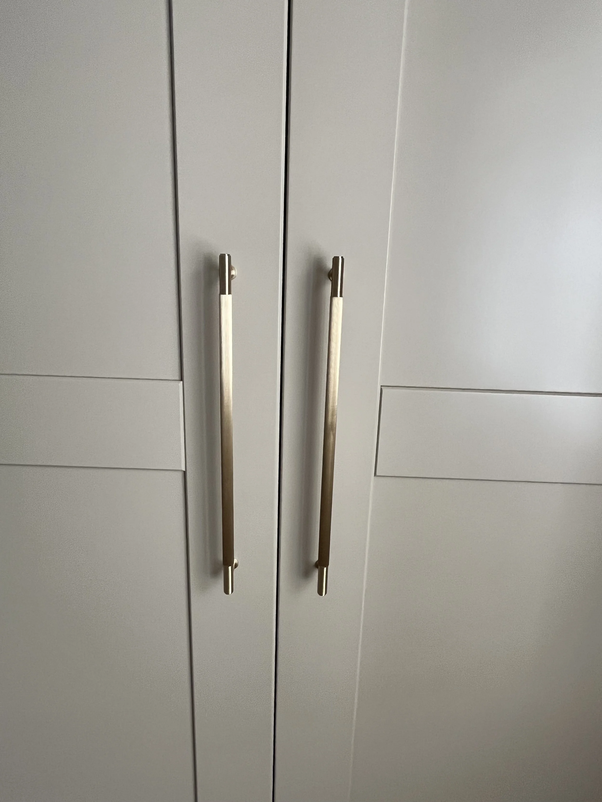 Bespoke Spray Finish Wardrobe Doors with Gold Bar Handles.