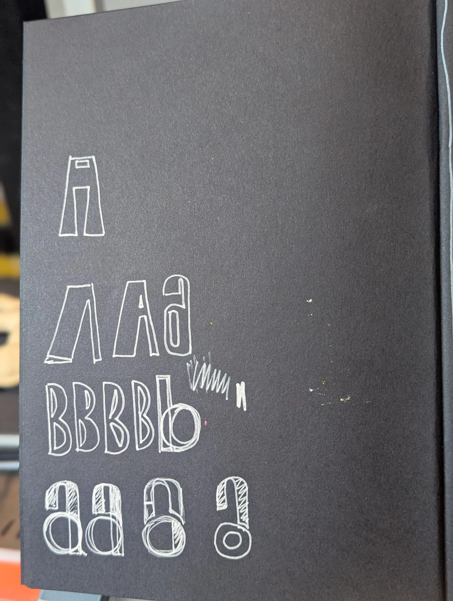 A black menu board with white chalk-like handwritten text and illustrations of bottles and glasses, listing various drink options.