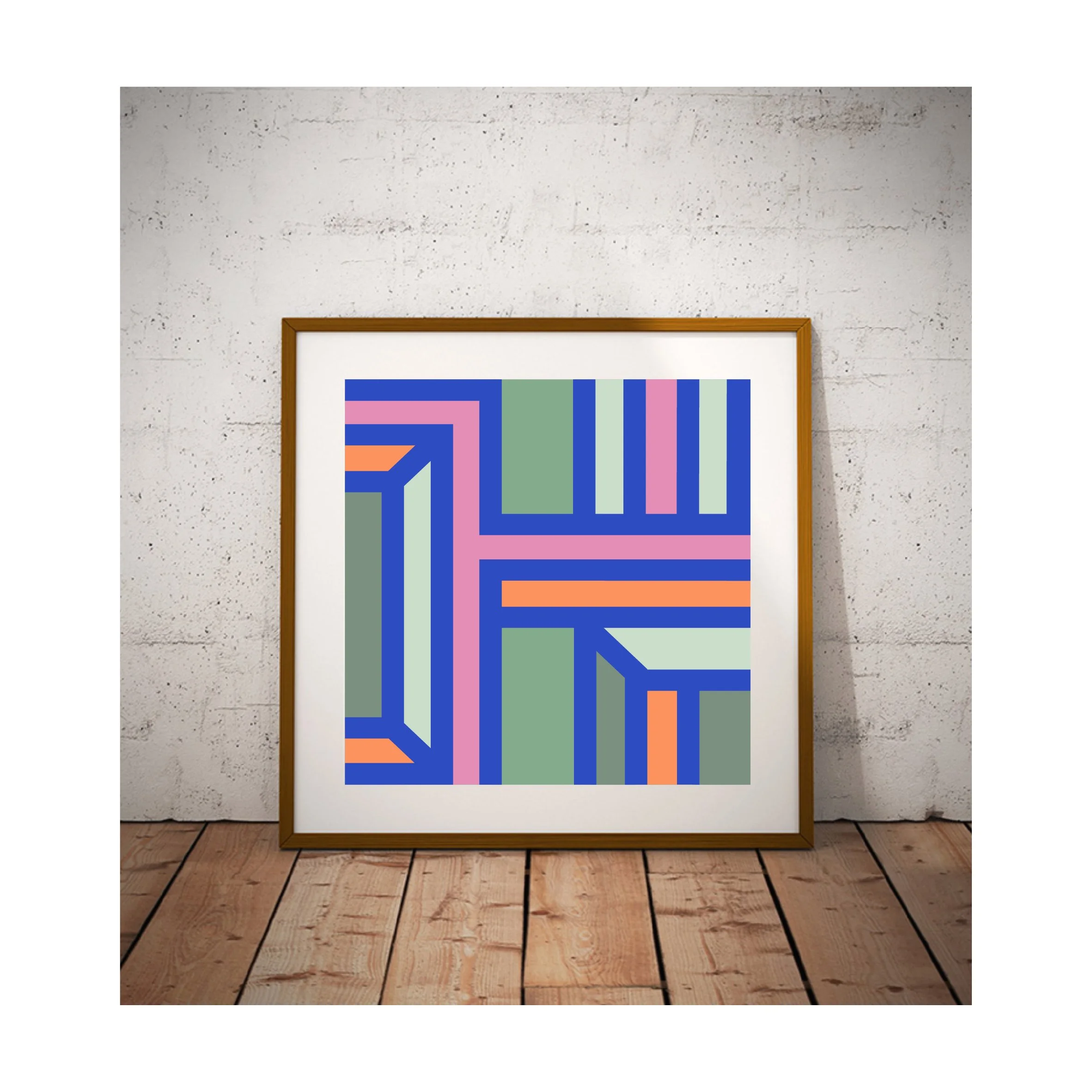 Framed geometric abstract art print displayed against a textured wall with wooden flooring in a rustic contemporary interior.