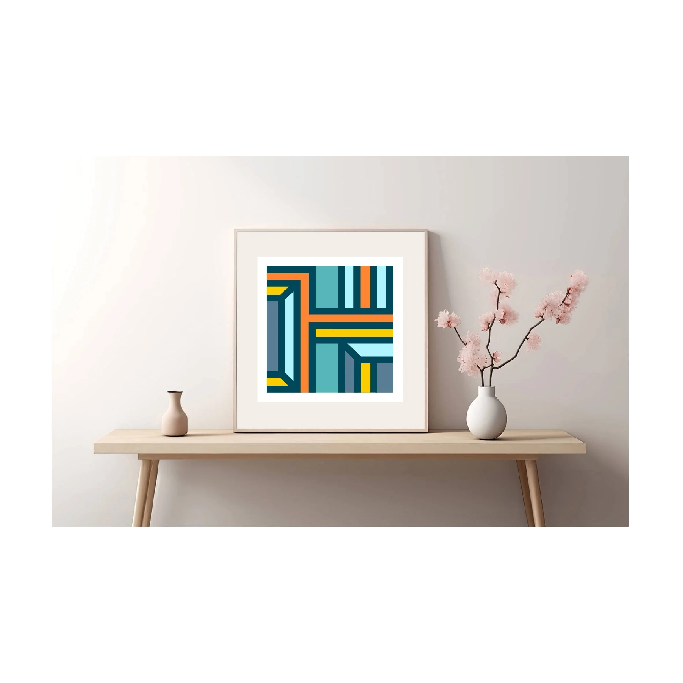 Framed geometric abstract art print displayed on a minimalist wooden console table in a contemporary interior.