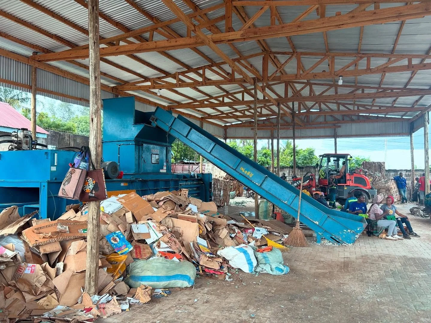 Rainy season ready&mdash;keeping the cardboard dry and operations moving under cover beside the baler. Waste never waits, and neither do we!