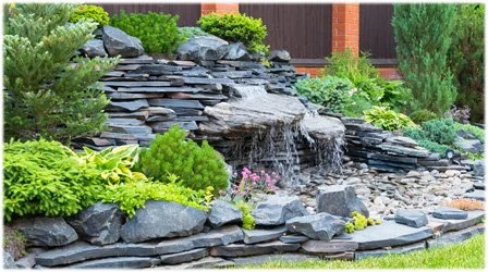 yard waterfall using rocks and vegitation