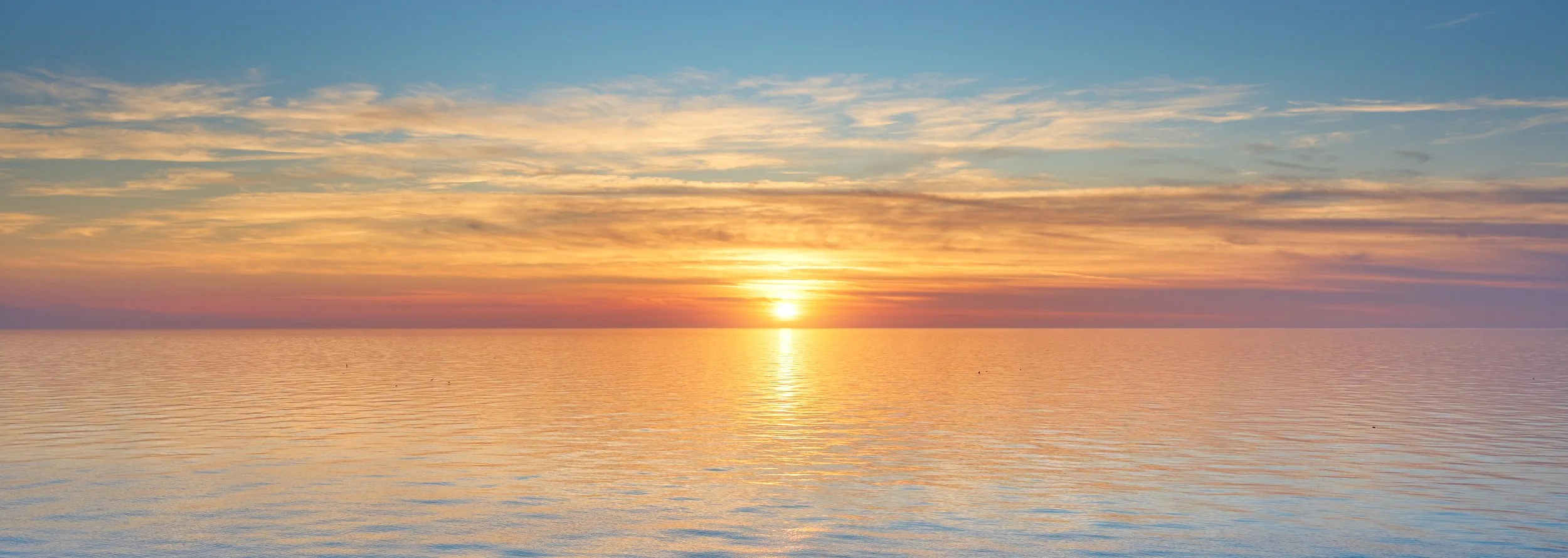 A sunrise over a lake