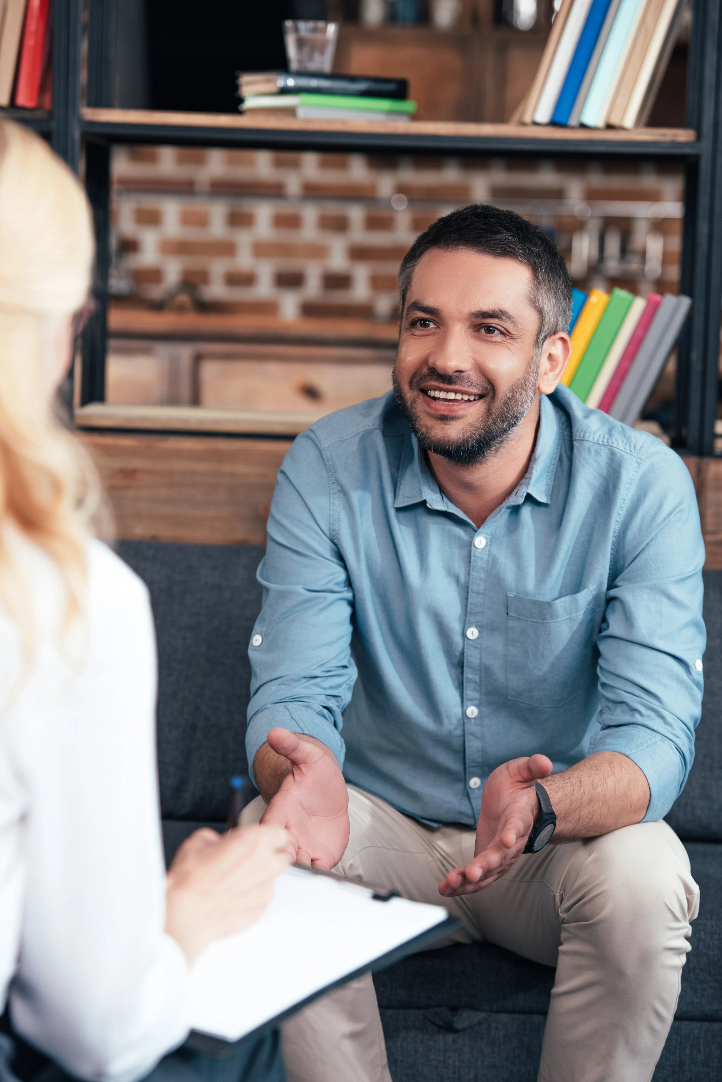 Man talking with counselor in office