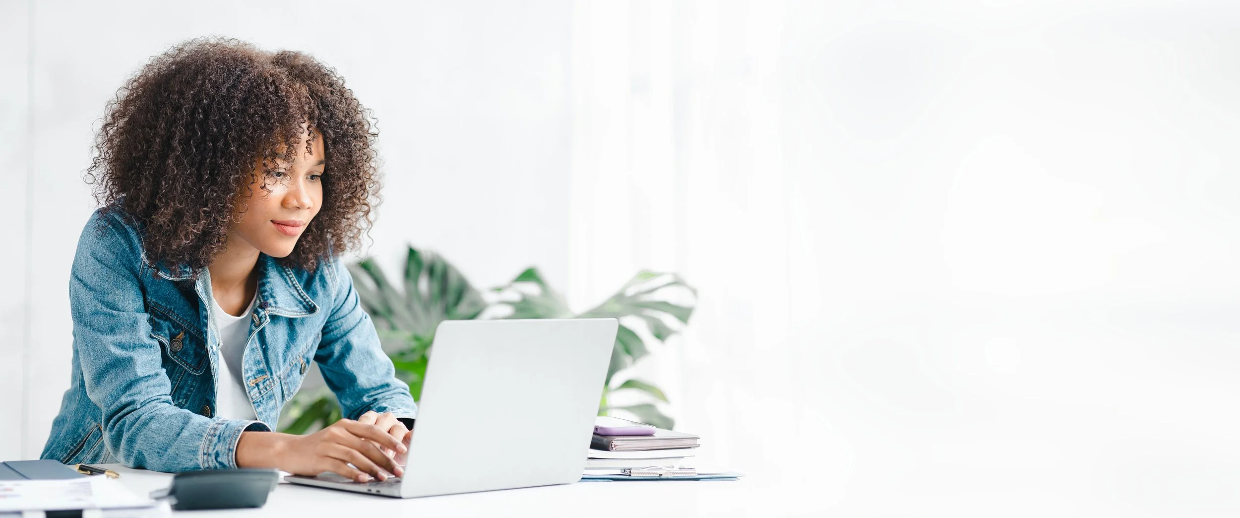 Young woman booking an appointment on her laptop