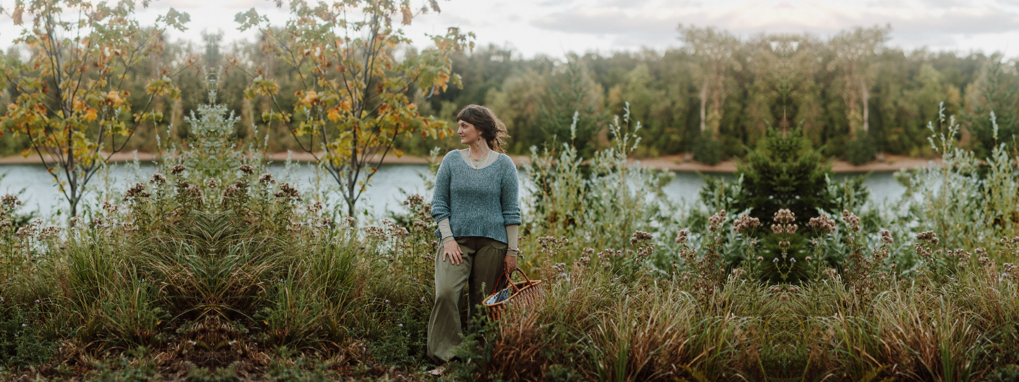 Emily Rose Meredith, somatic practitioner and hypnotherapist in Portland, Oregon, smiling in natural nature