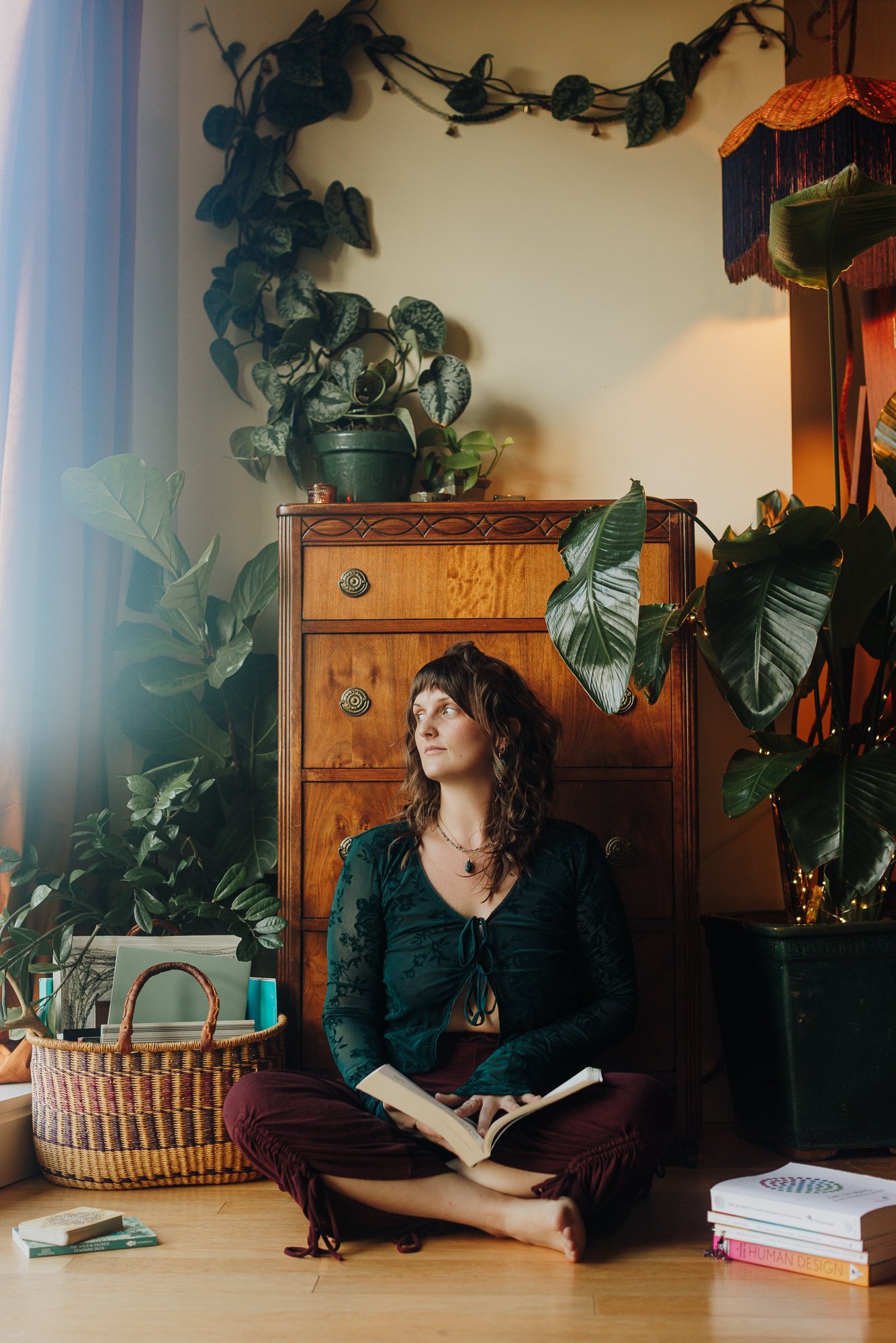 Emily Rose Meredith seated barefoot with hands resting in her lap, hypnotherapist and Parts Integration (IFS) practitioner in Portland
