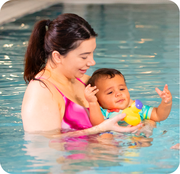 Mother with her child in the pool
