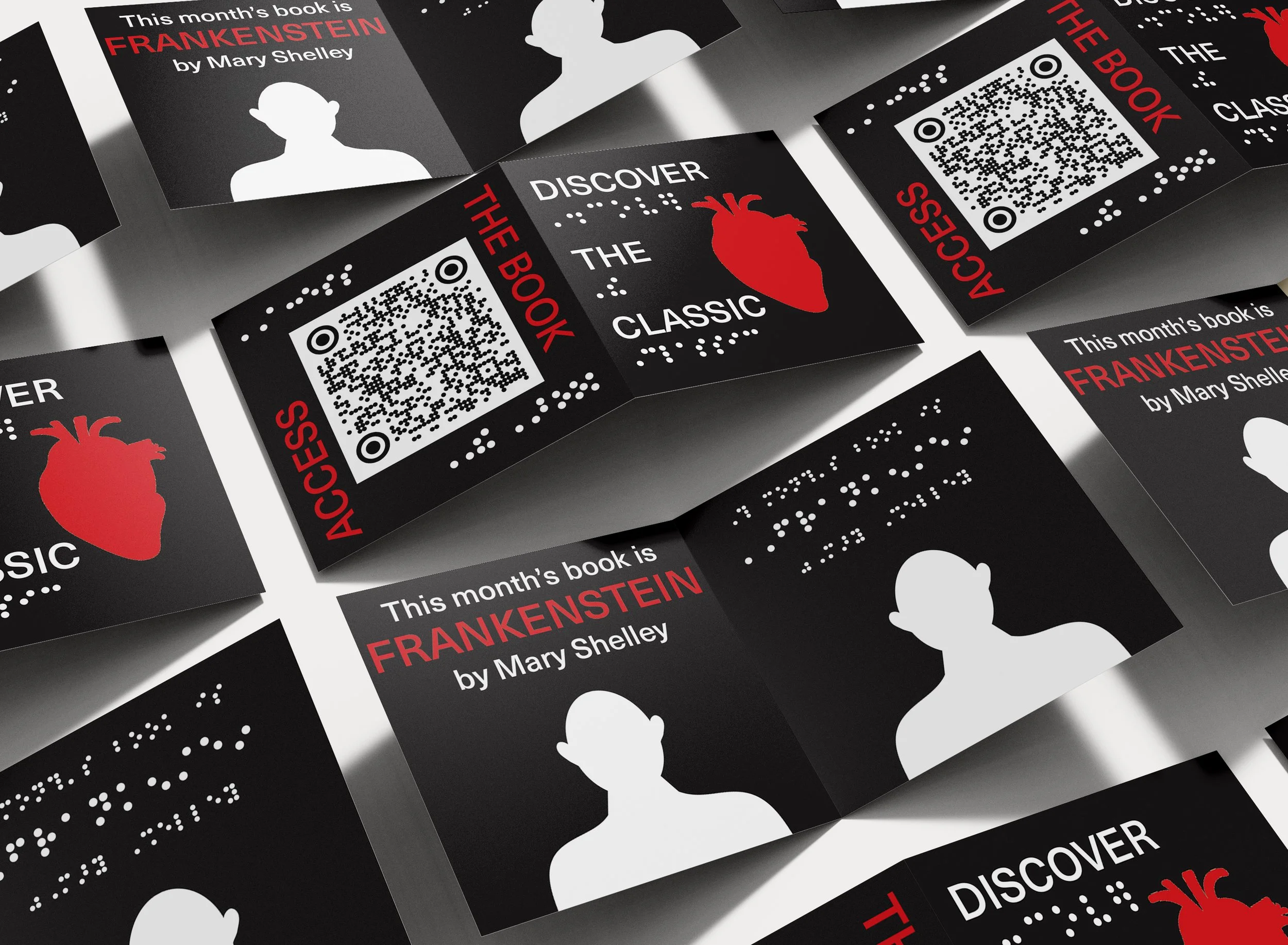Multiple printed cards featuring a promotion for the book 'Frankenstein' by Mary Shelley, including a QR code, a red heart illustration, and text that says 'Discover the book.' The cards are arranged in a collage style.