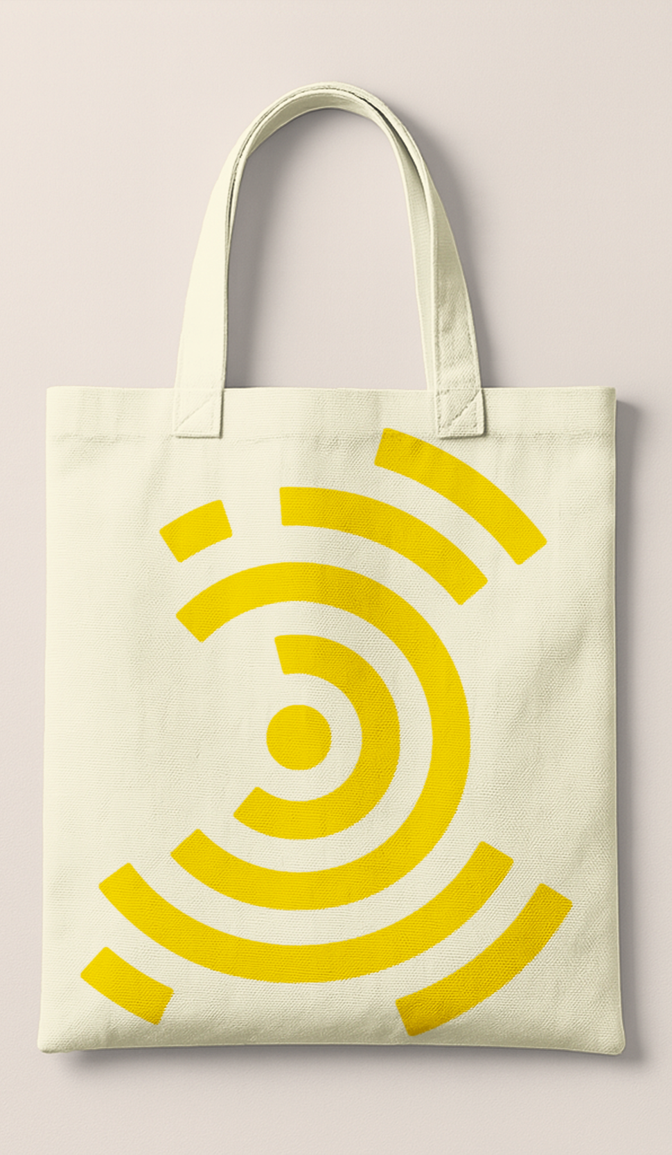 Canvas tote bag with yellow Wi-Fi symbol design on white background.