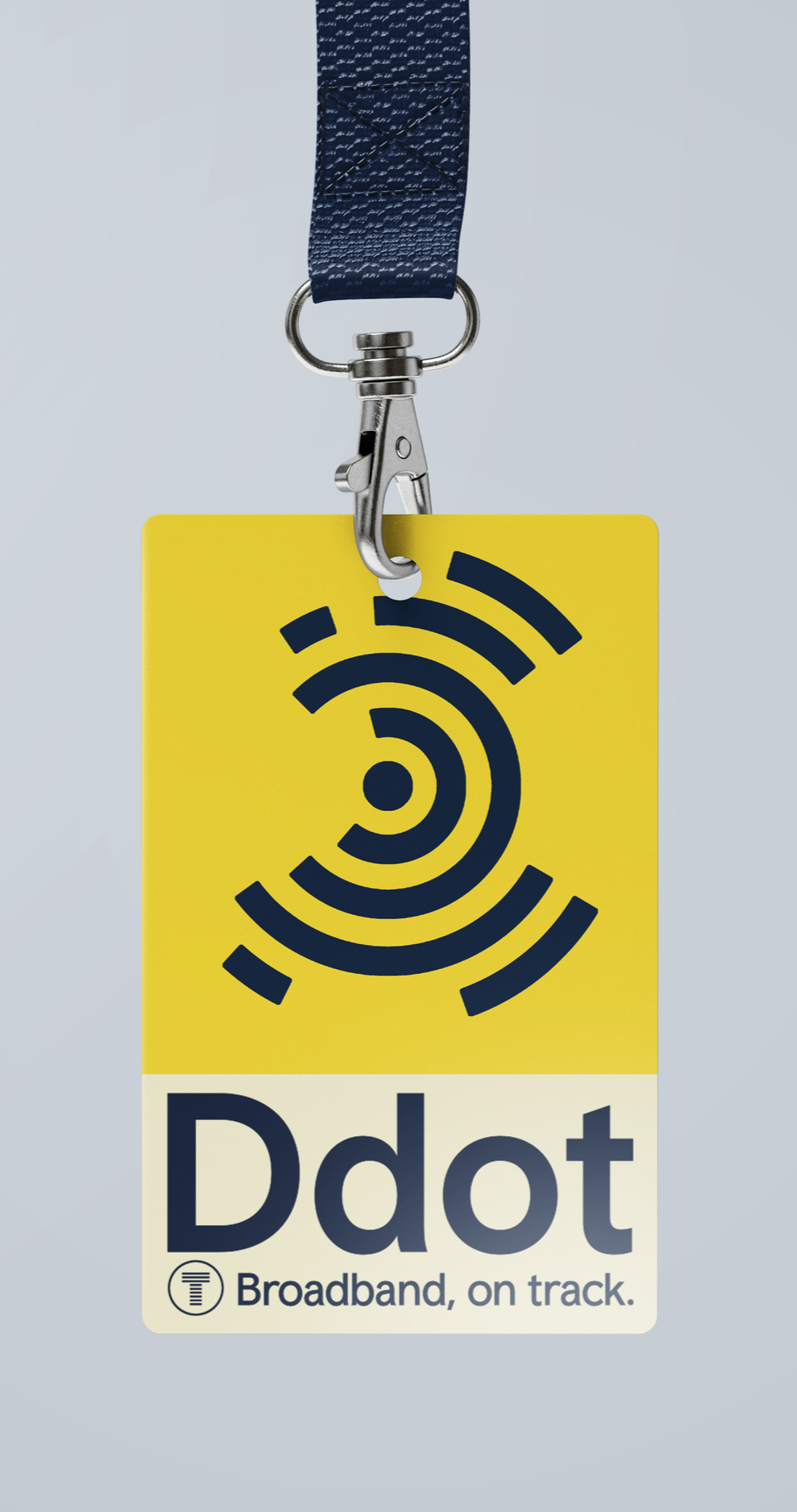 Yellow broadband access badge with a black concentric circles Wi-Fi symbol and the text 'Ddot Broadband, on track,' attached to a blue fabric lanyard.