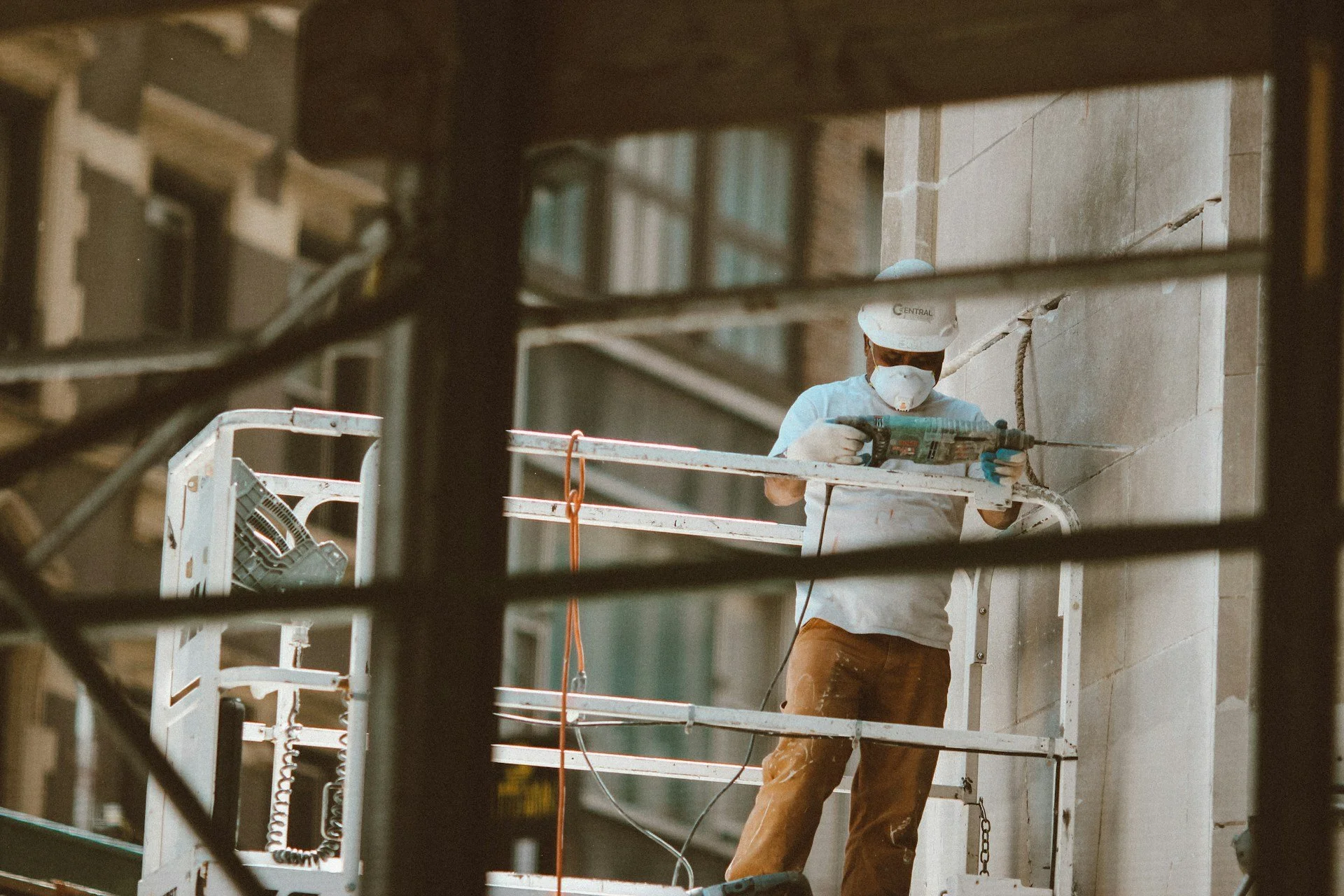concrete construction worker repairing wall