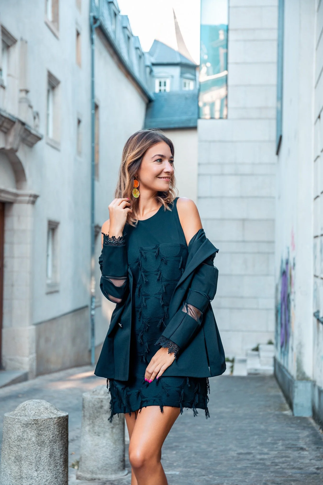 Fashion portrait in Luxembourg City featuring a contemporary black look, photographed by Henri Da Cruz.
