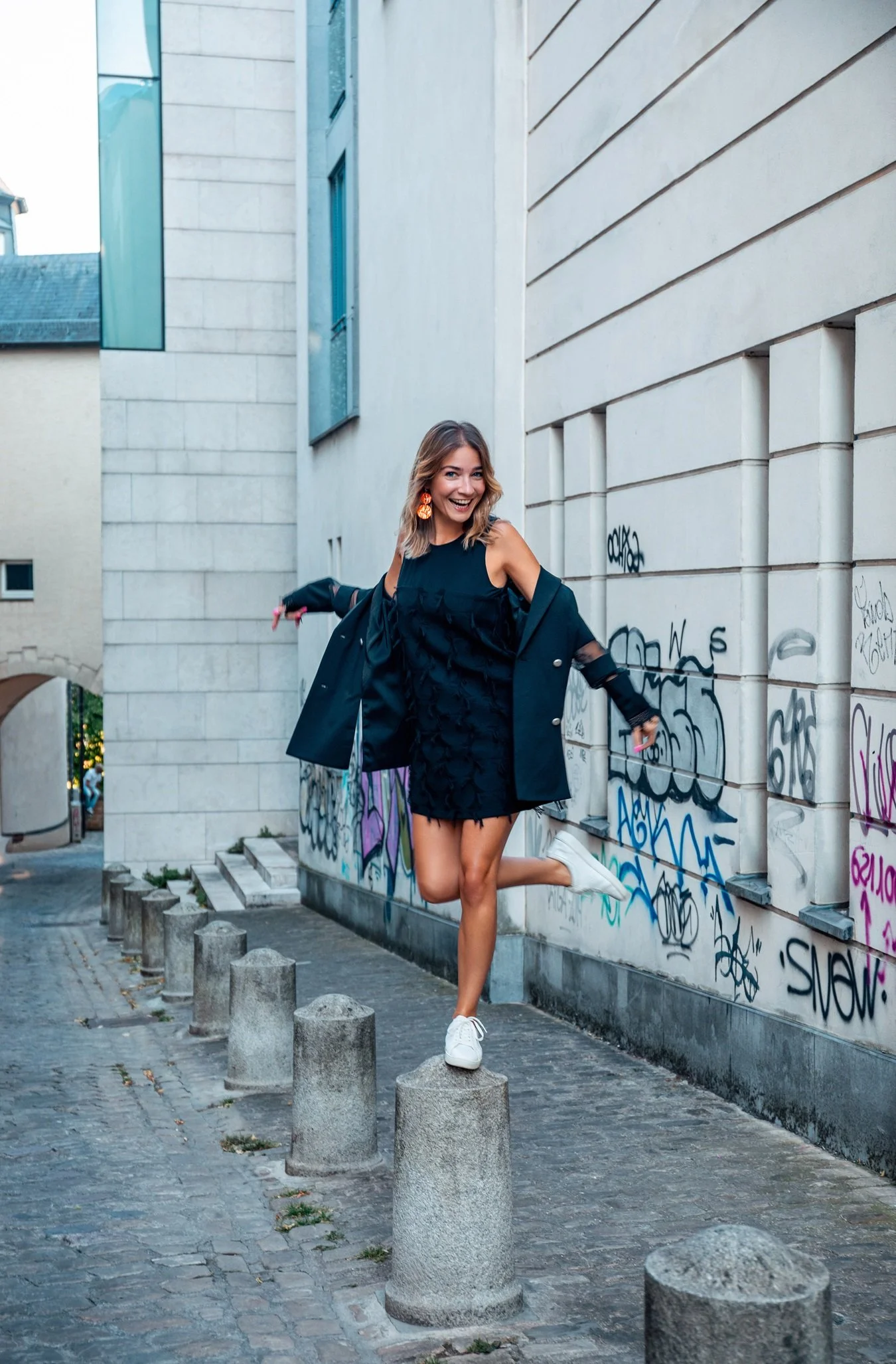 Urban fashion editorial in Luxembourg City, featuring a contemporary black look photographed by Henri Da Cruz.