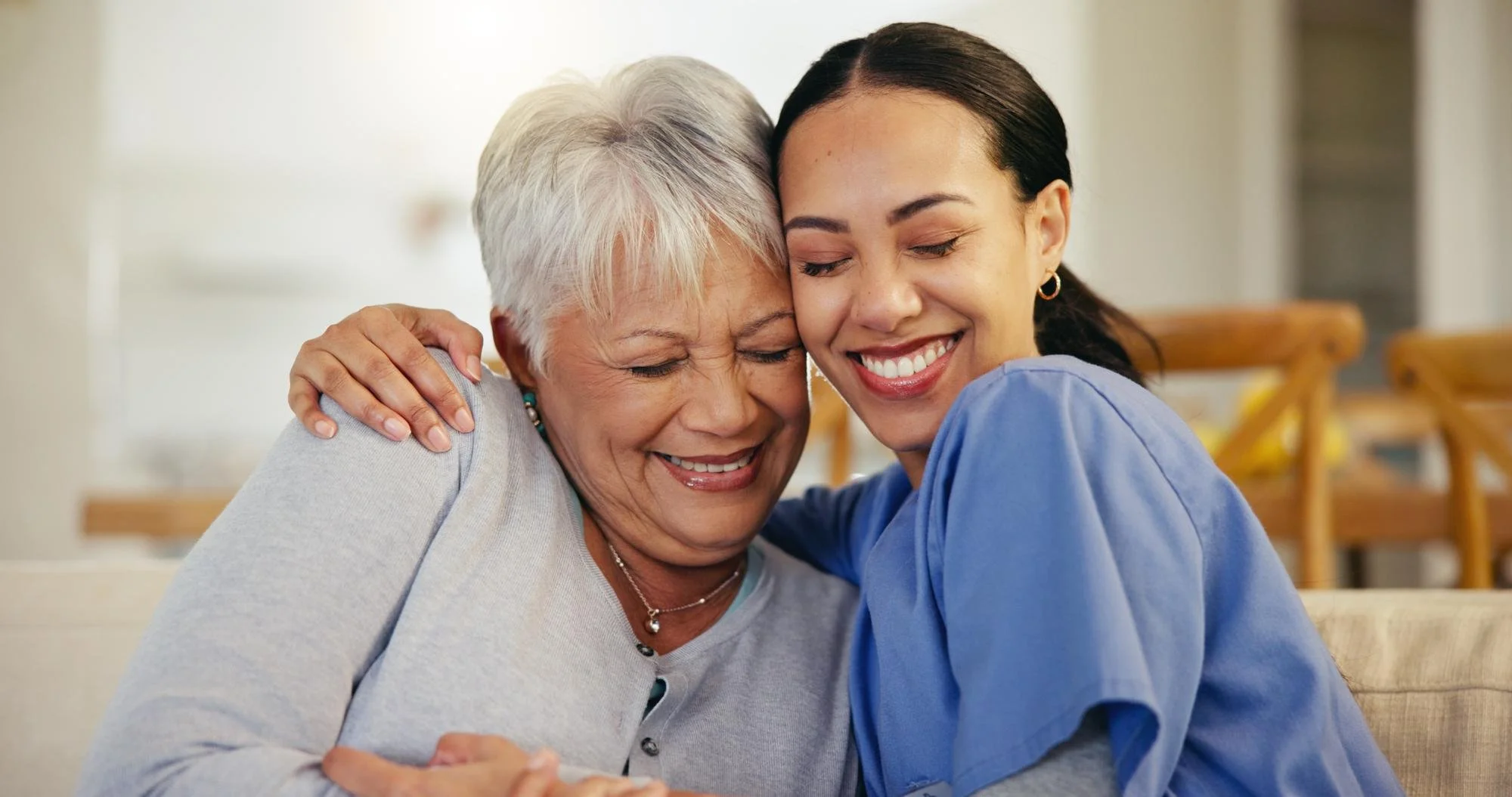 A home care worker providing personal care support to an elderly resident in Reservoir, Melbourne.