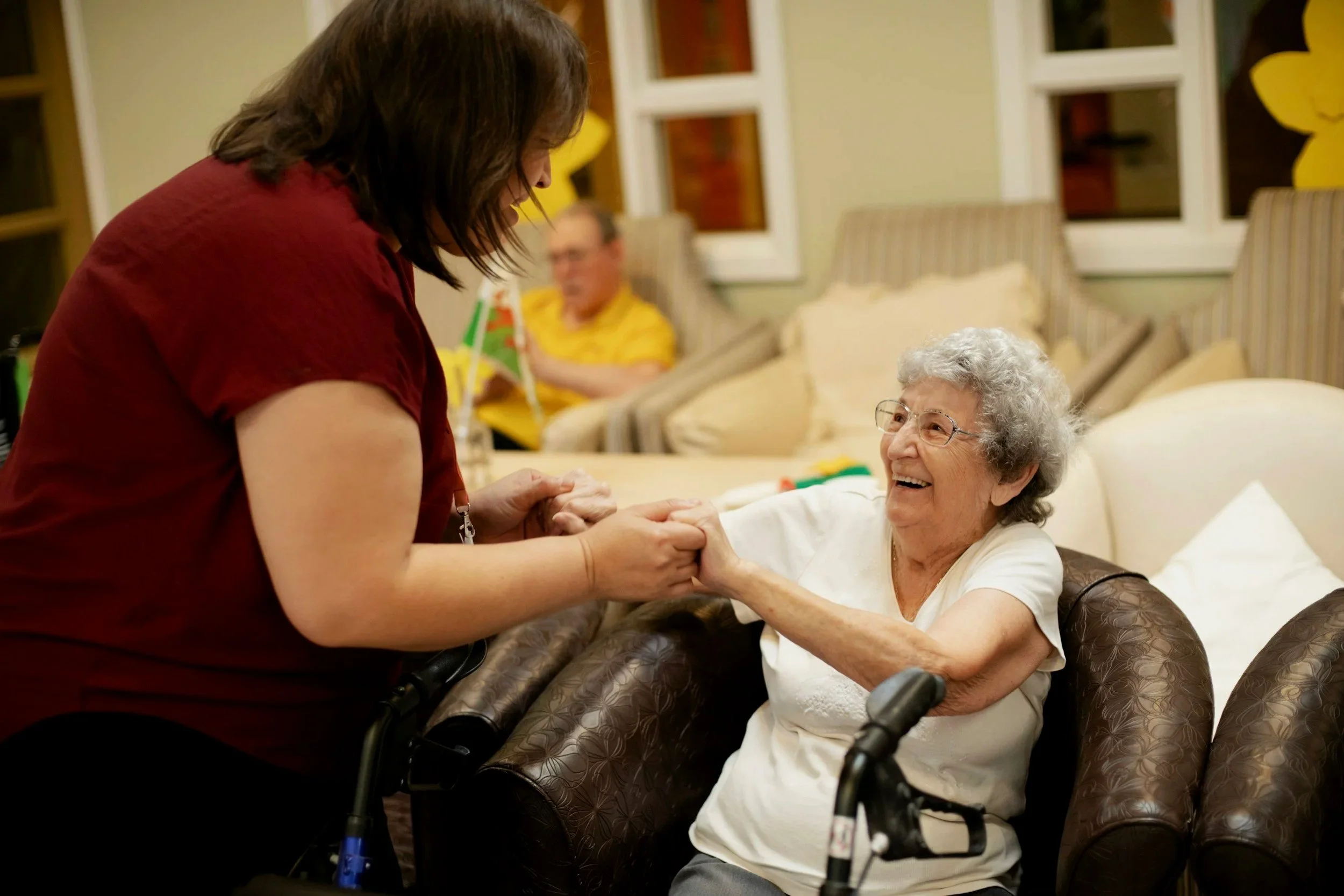 An elderly woman receiving warm, compassionate home care and social community services from a dedicated support worker in Victoria.