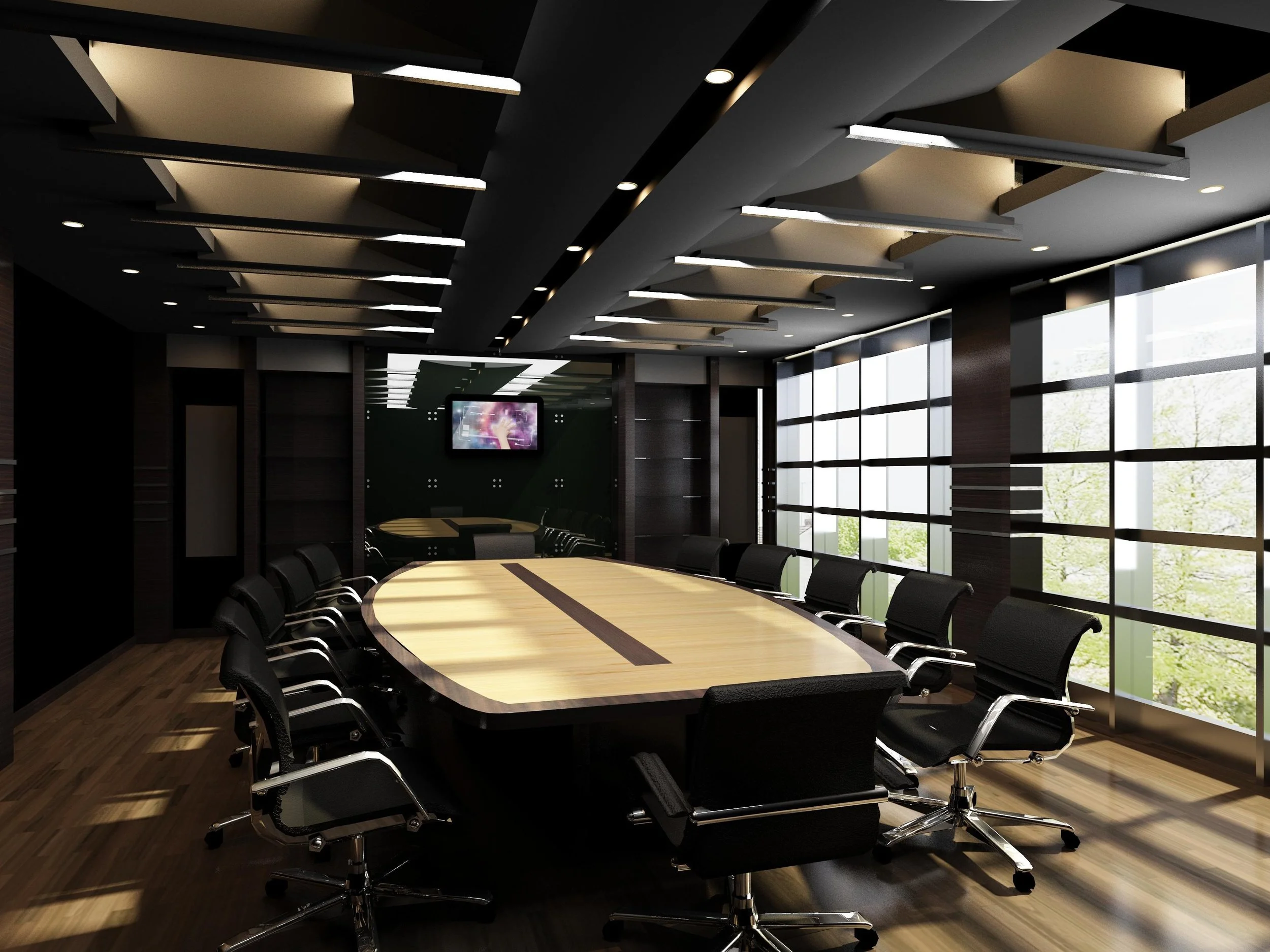 A modern conference room with a long wooden table surrounded by black office chairs, large windows with blinds, and a wall-mounted screen showing a colorful abstract image.