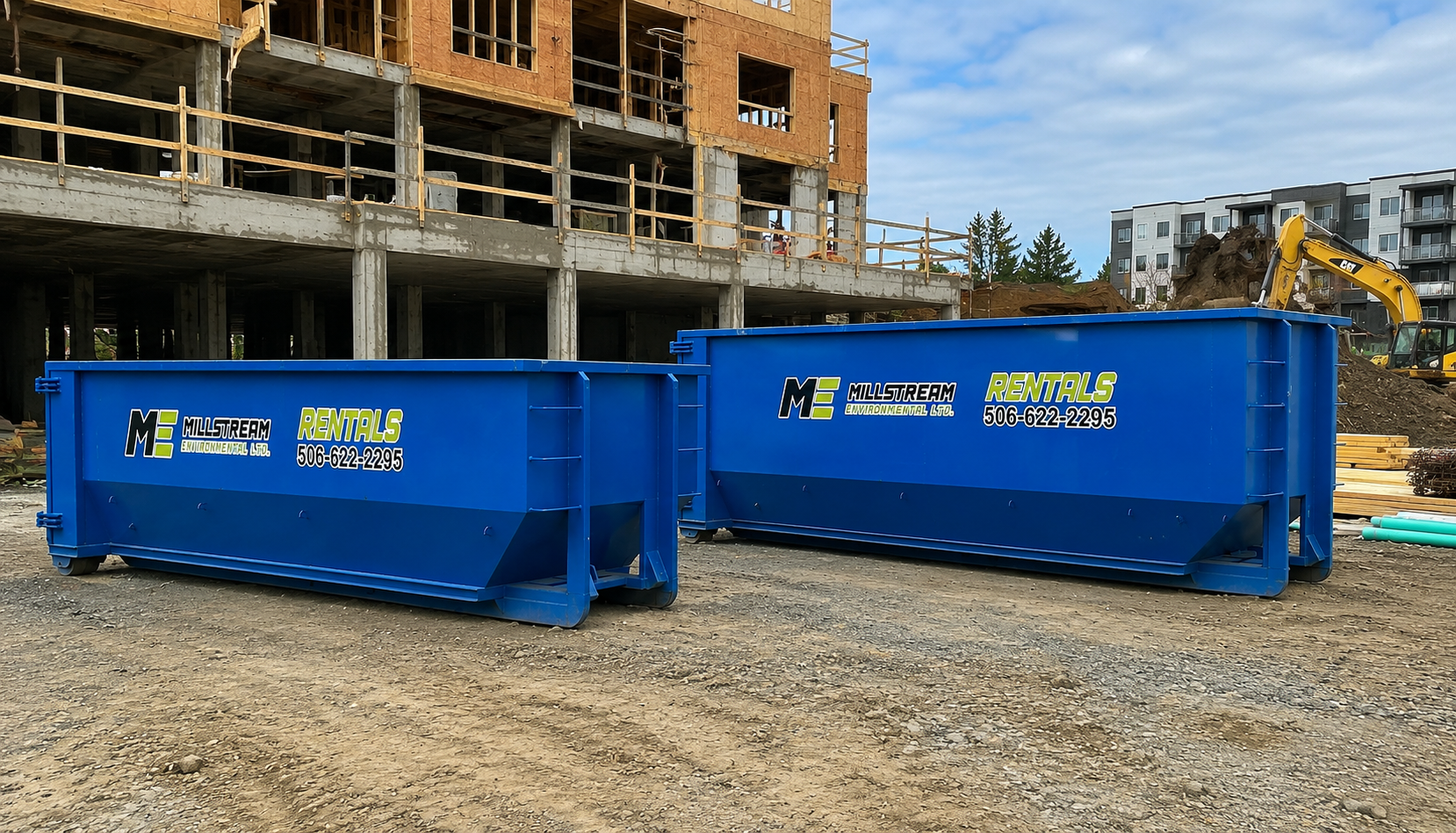 Two blue construction dumpsters at a building site with an unfinished wooden building and a yellow excavator in the background.