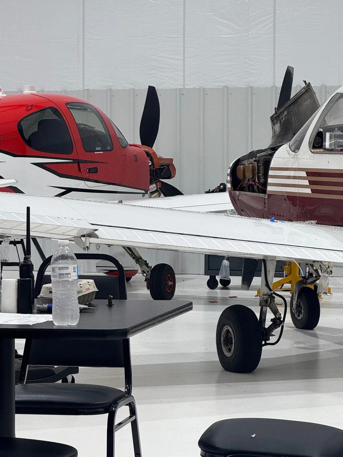 Aircraft undergoing maintenance inside the Total Aircraft hangar
