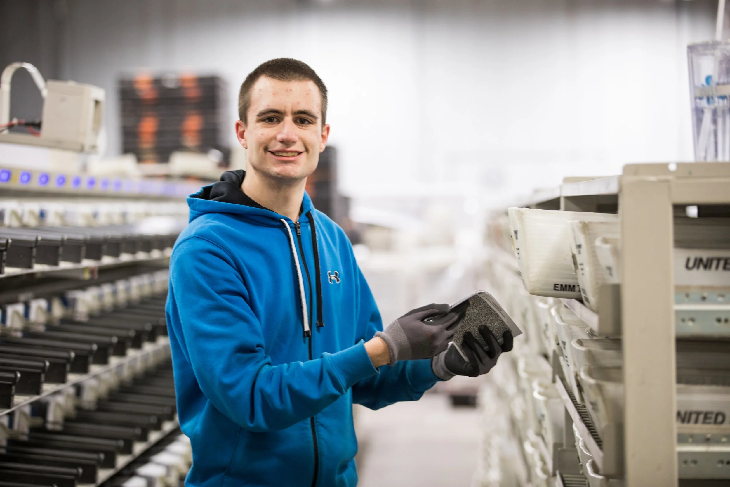 A Tandem Solutions worker working at one of their mail facilities across the United States.