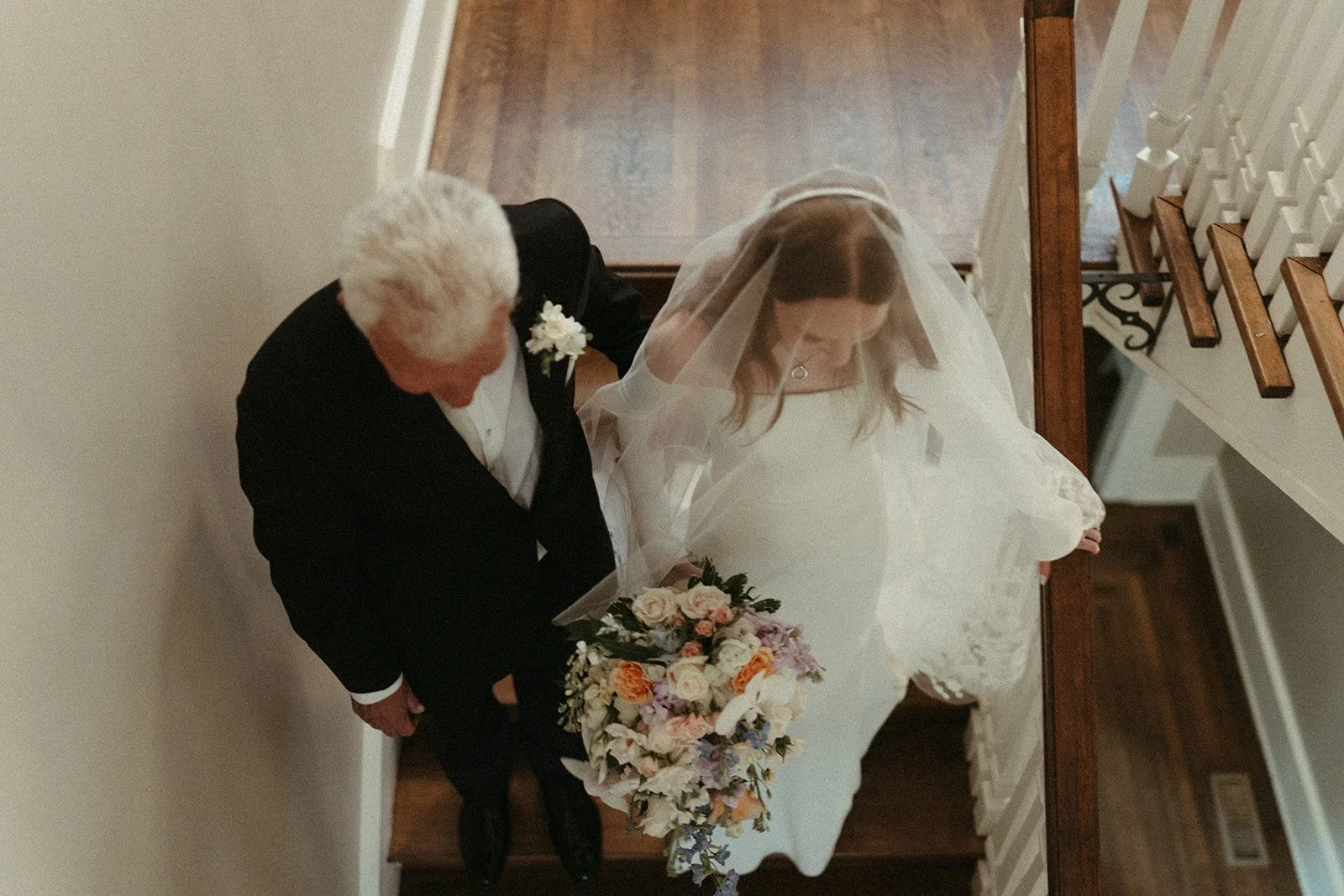 Bride walking down the steps with her father
