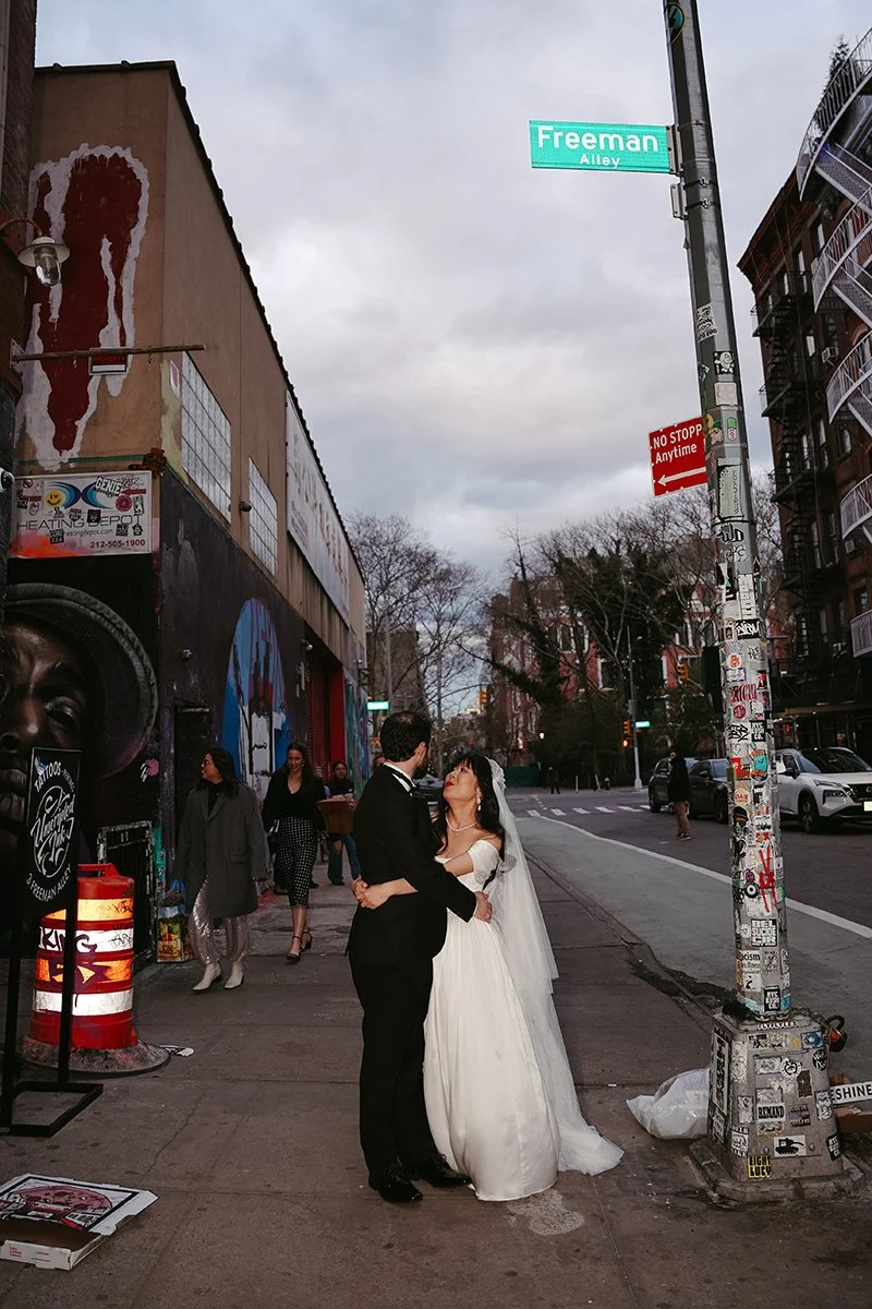 a bride and groom on their wedding day on the lower east side in manhattan