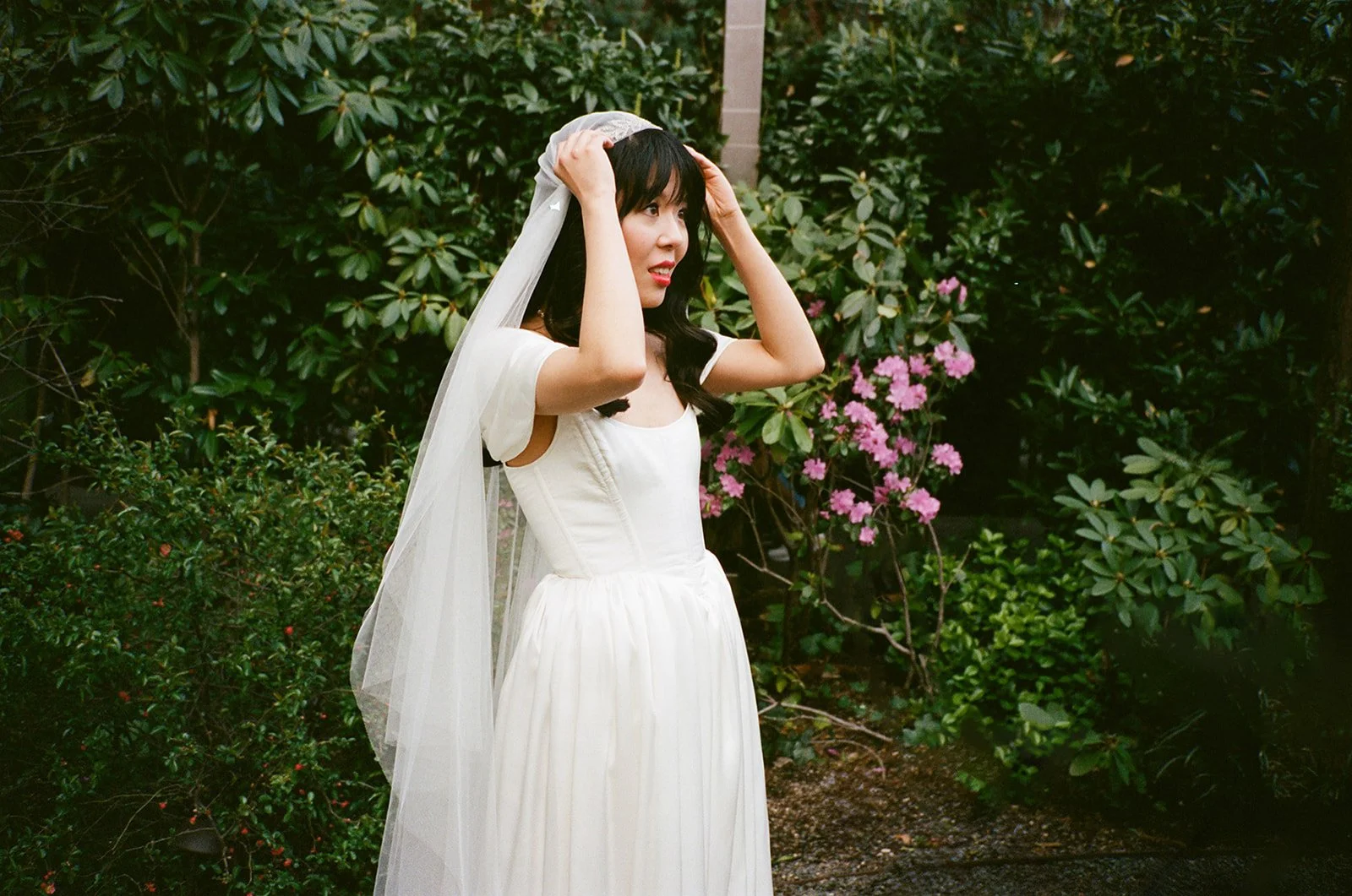 a new york city bride adjusting her veil