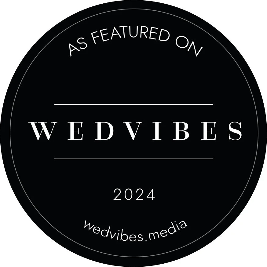 Black circular badge with white text that reads "As Featured on WEDVIBES 2024 wedvibes.media."