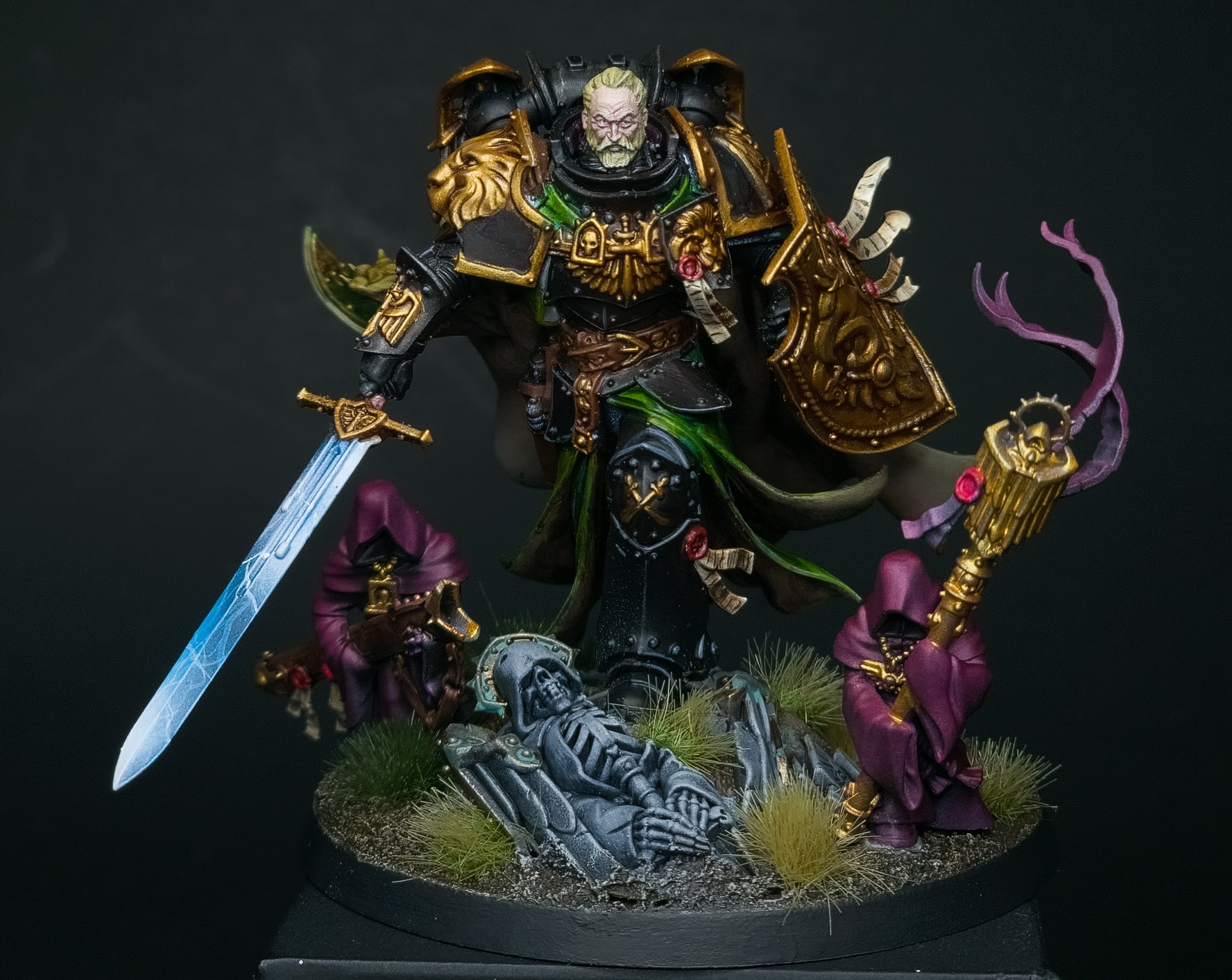 A detailed painting or miniature figure of a regal warrior in black and gold armor, with a white beard, wielding a sword, surrounded by purple-skinned creatures, set on a base with grass and skulls.
