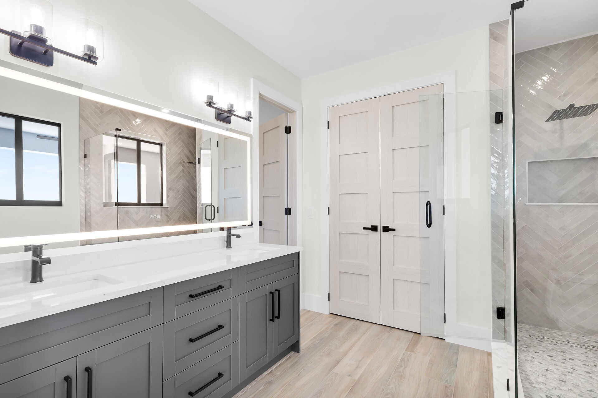 Designer bathroom with frameless glass shower in Stirrup Key luxury home
